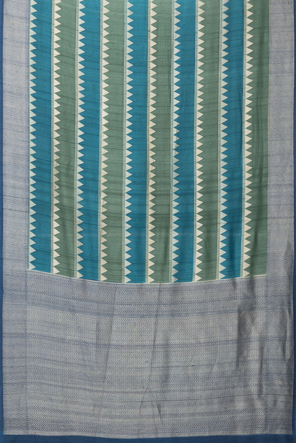 Flat view of Multi Color Tussar Silk Saree with Stripes on the body and Zari Border. 