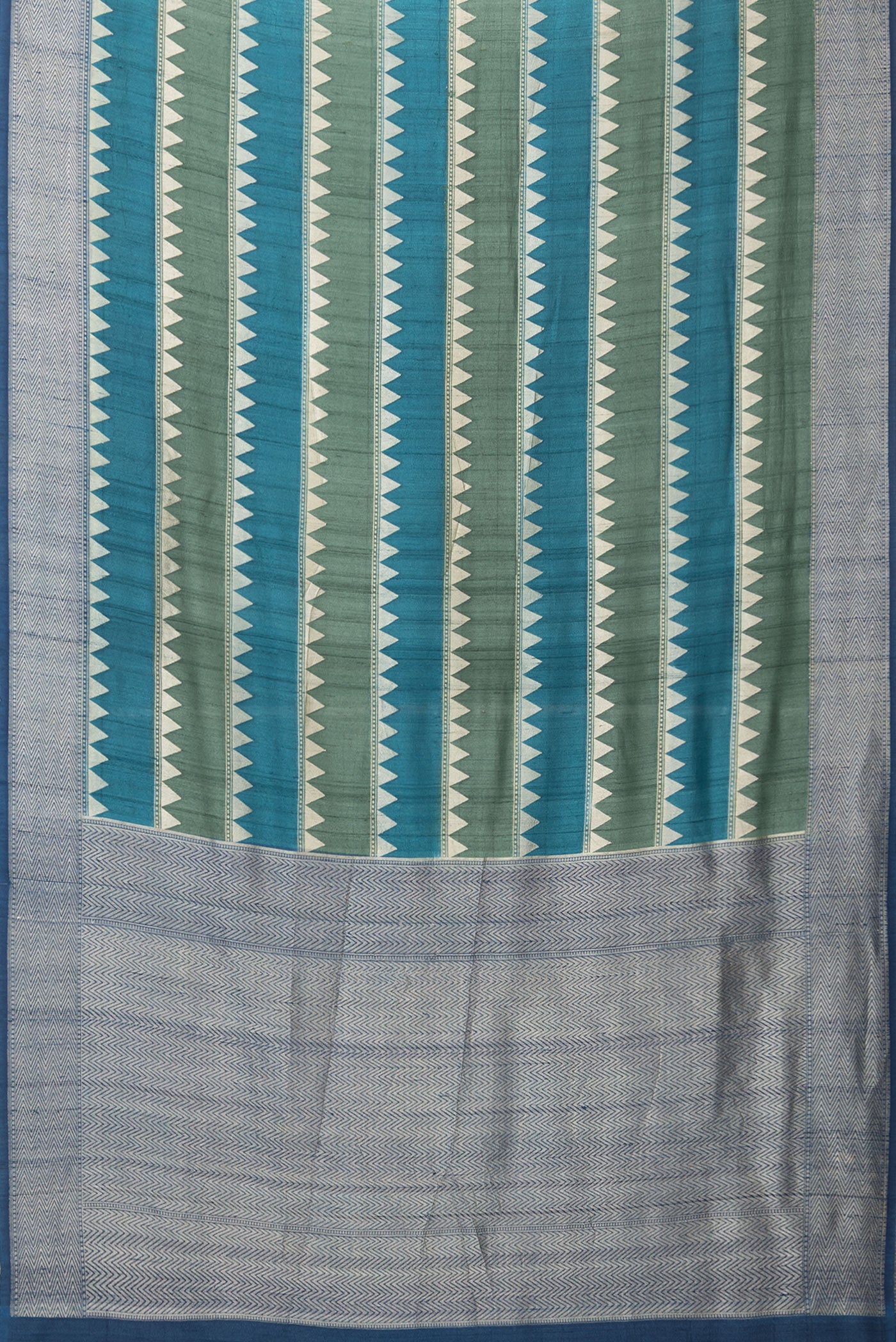Flat view of Multi Color Tussar Silk Saree with Stripes on the body and Zari Border. 