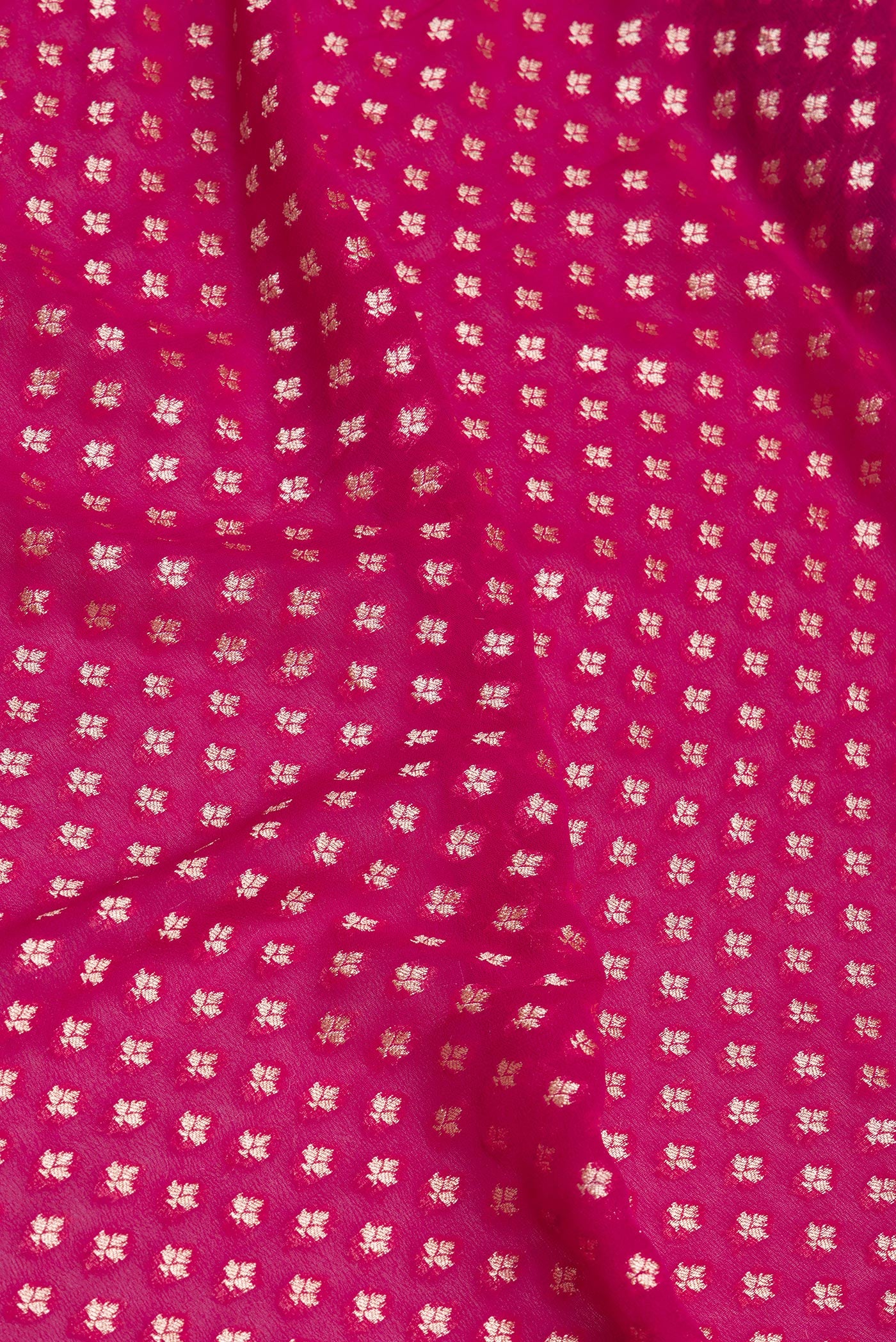 Close up of Pink Banarasi Georgette Saree with Zari Brocade on the body and Zari Border.  displaying folds