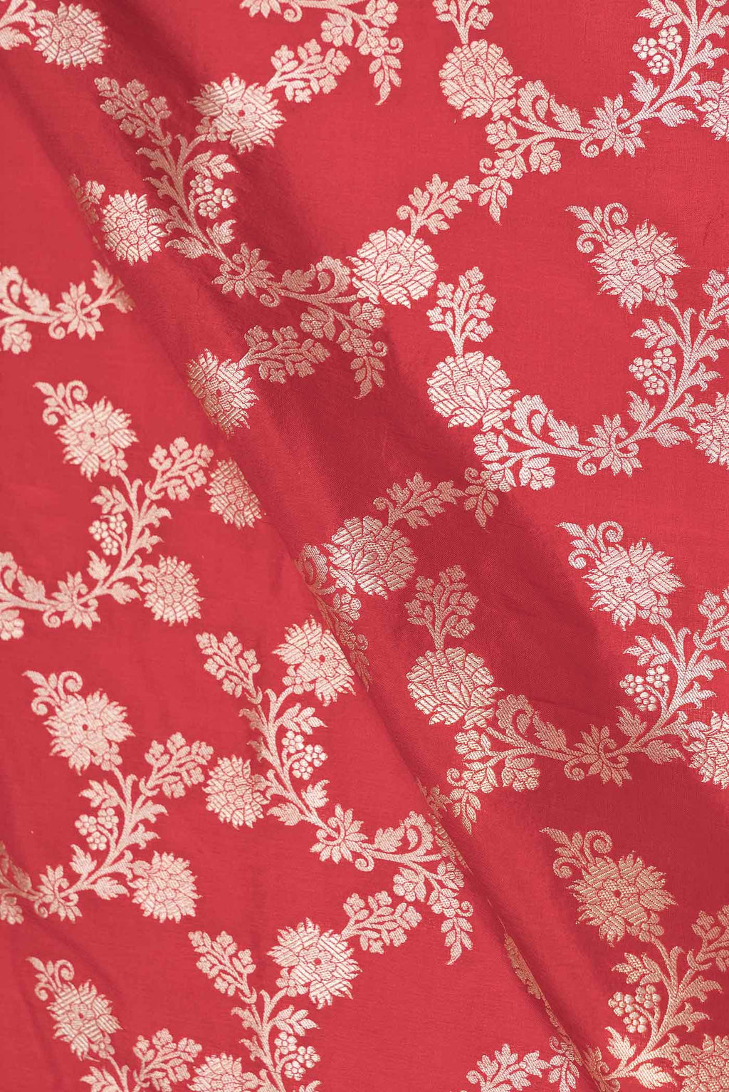 Close up of Red Dual Tone Banarasi Silk Saree with Zari Brocade on the body and Zari Border displaying folds