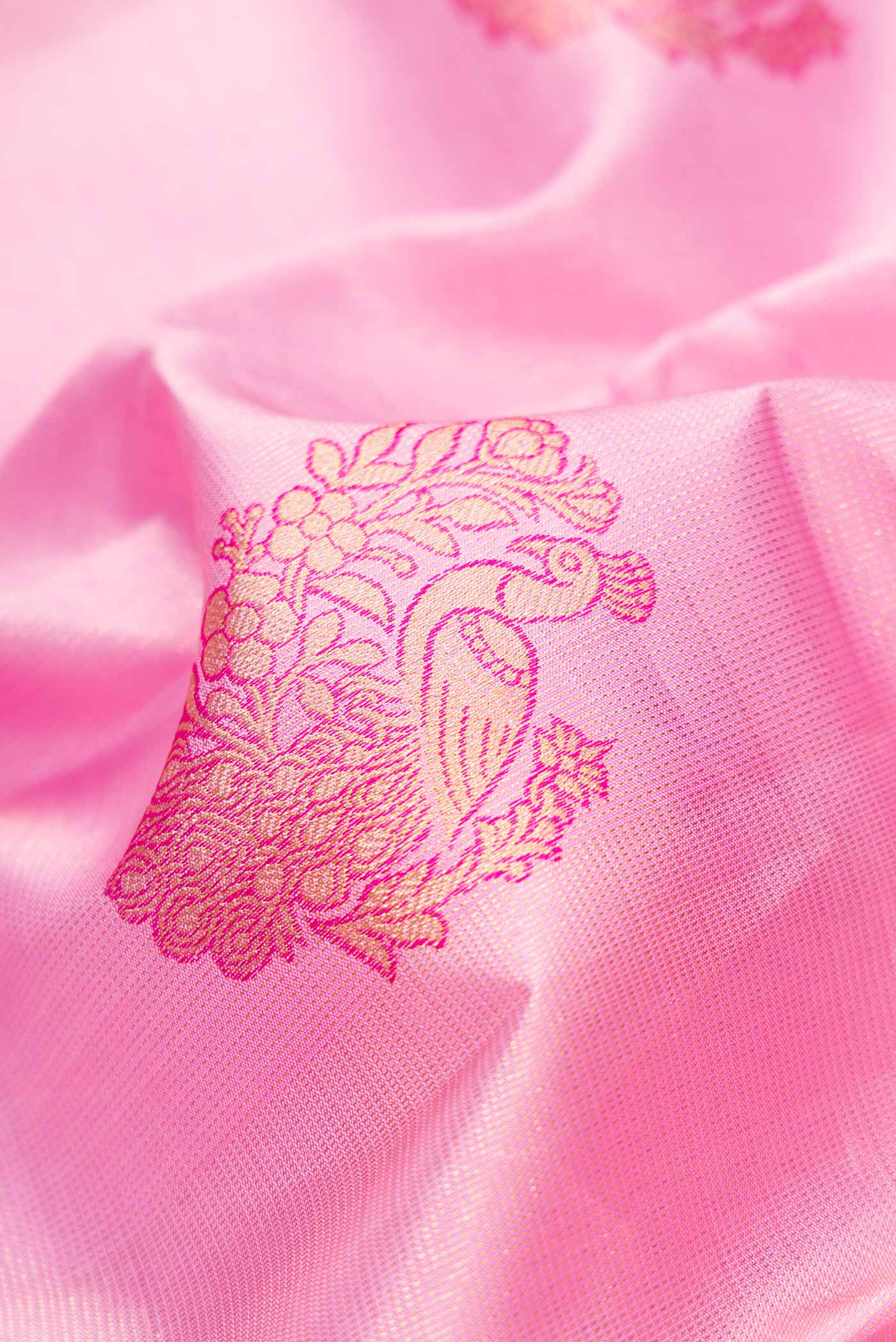 Close up of Pink Dual Tone Kanjivaram Silk Saree with Zari Brocade on the body and Zari Border.  displaying folds
