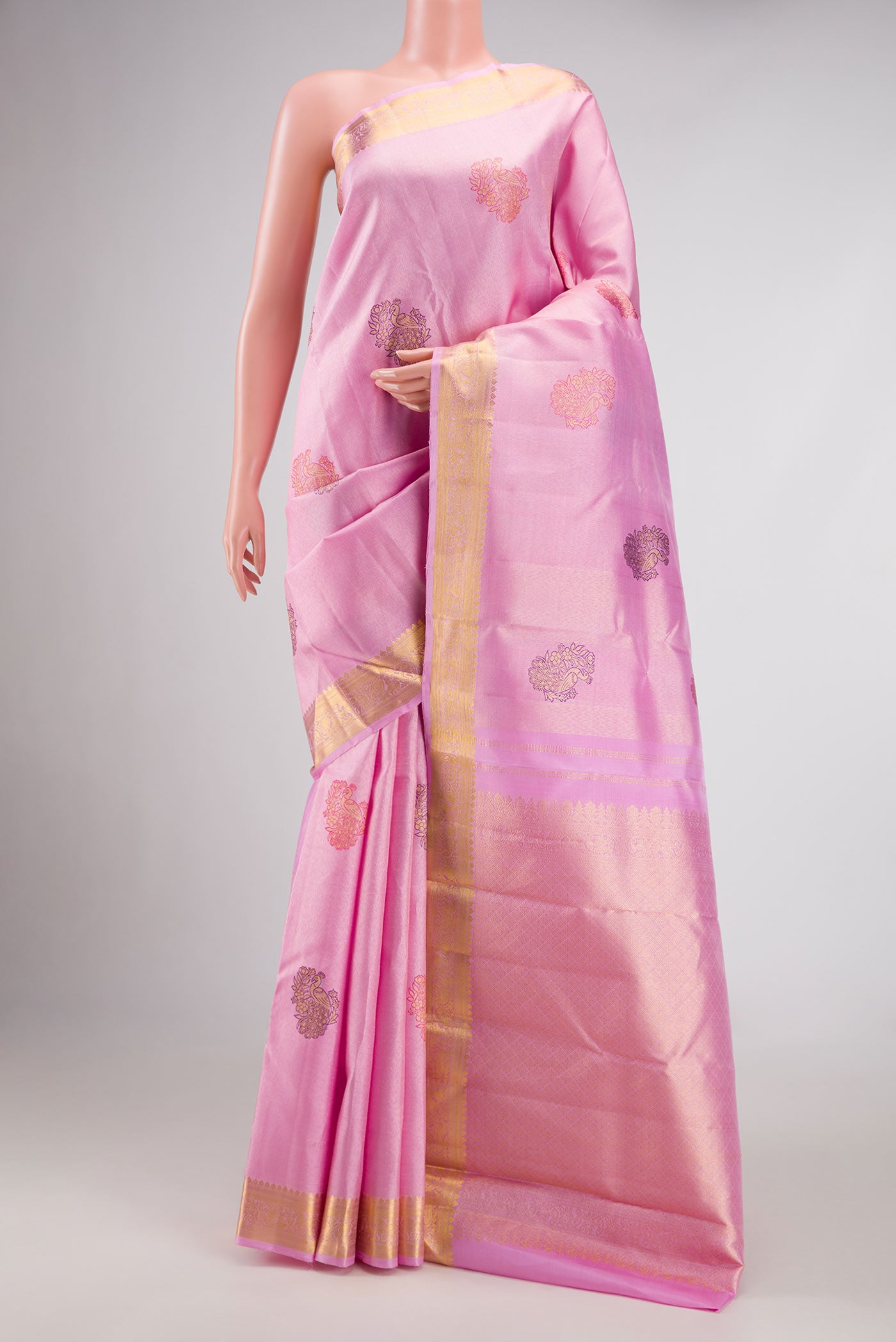 Pink Dual Tone Kanjivaram Silk Saree with Zari Brocade on the body and Zari Border.  displayed on a mannequin