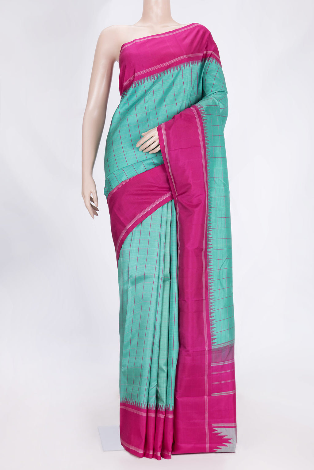 Green Dual Tone Kanchipuram Saree with Checked design on the body and Thread Border.  displayed on a mannequin