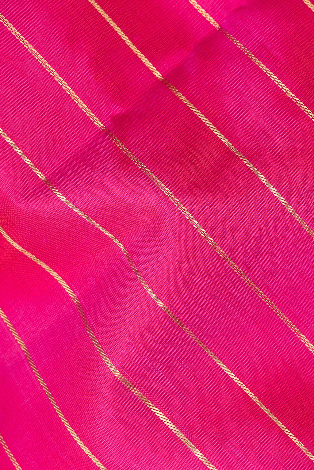 Close up of Pure Silk Dark Pink Kanjivaram Saree with Stripes on the body and Zari Border.  displaying folds