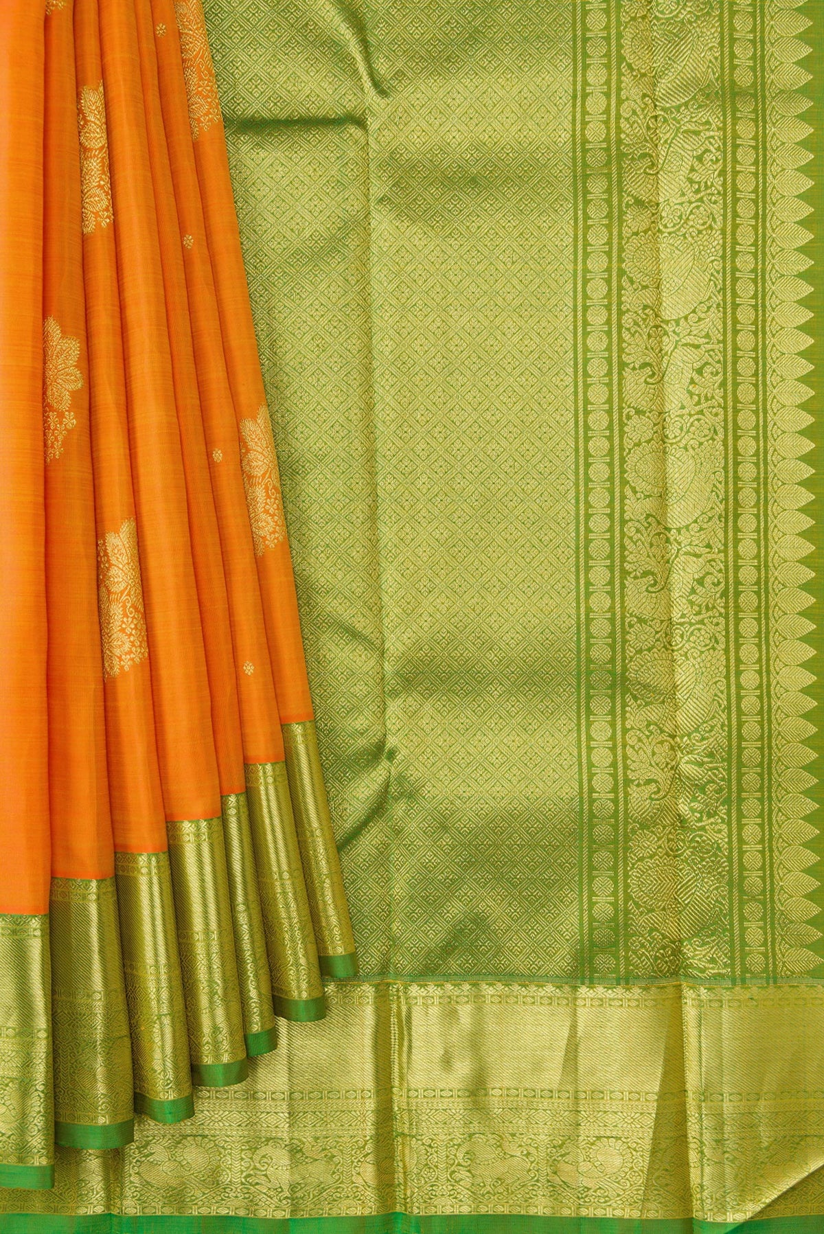 Pleats and pallu of Orange Dual Tone Kanjivaram Silk Saree with Zari Butta on the body and Zari Border. 