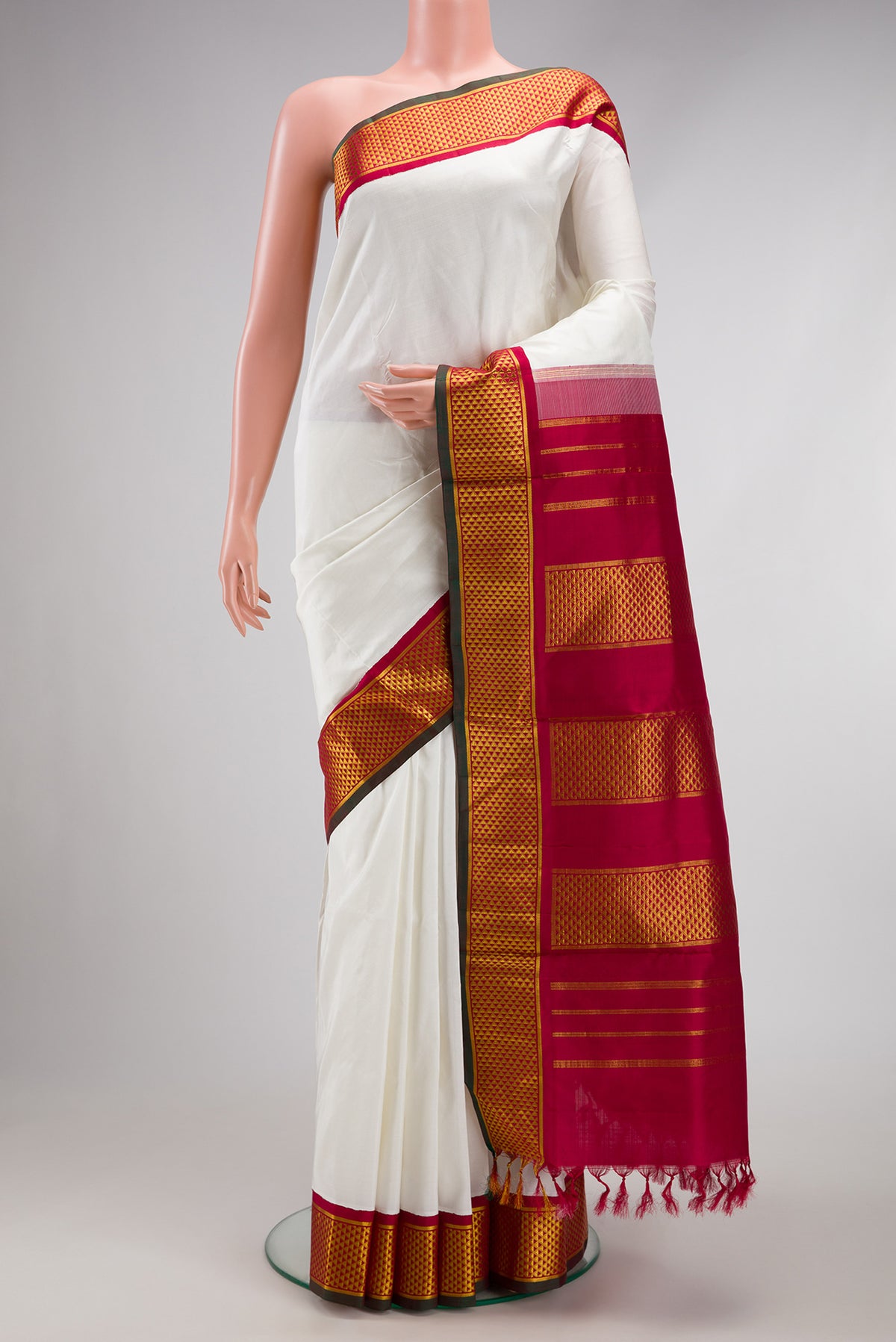 White Dual Tone Kanchipuram Silk Nine Yards Saree with Plain Body and Zari Border.  displayed on a mannequin