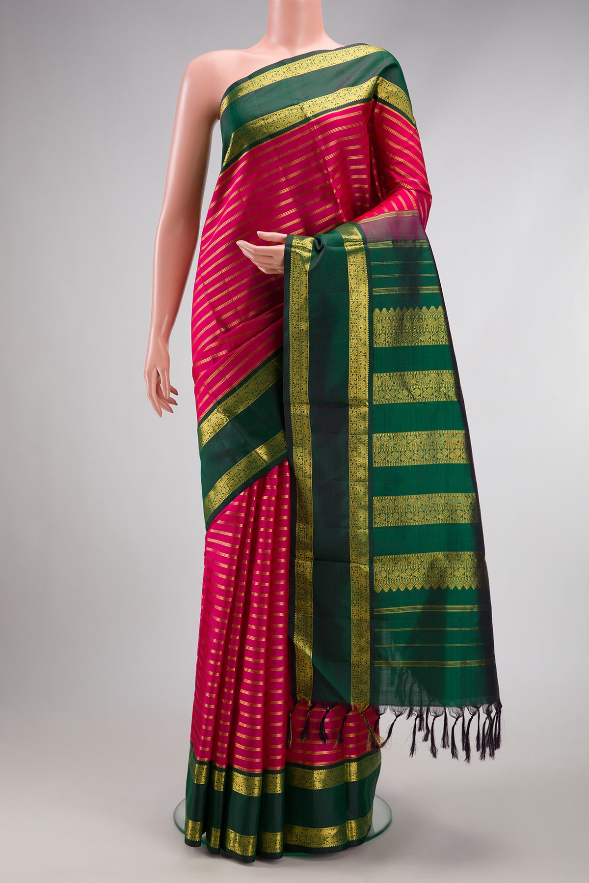 Dark Pink Kanchipuram Silk Nine Yards Saree with Stripes on the body and Zari Border.  displayed on a mannequin