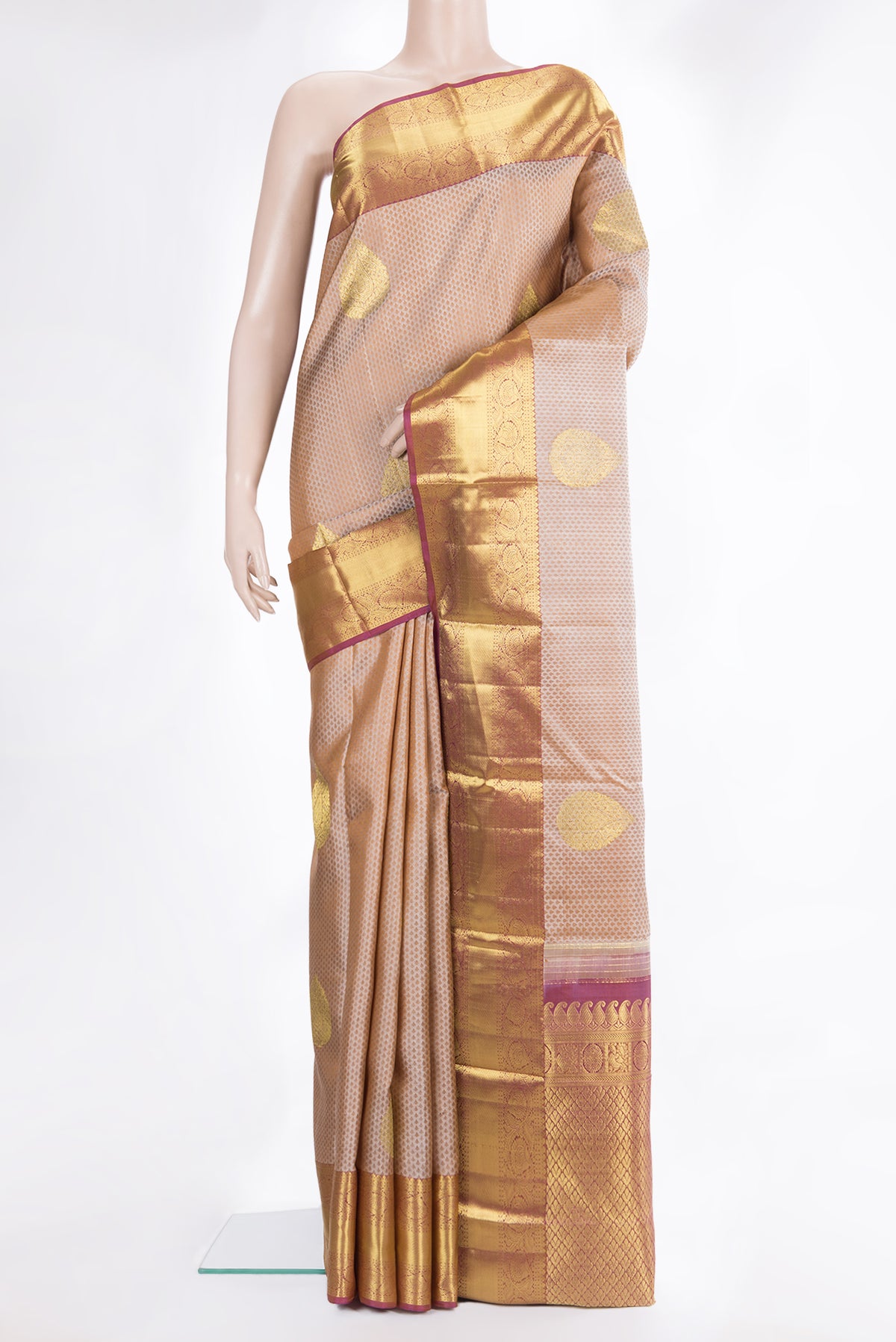 Pure Silk Beige Dual Tone Kanchipuram Saree with Jacquard With Zari Butta on the body and Zari Border.  displayed on a mannequin