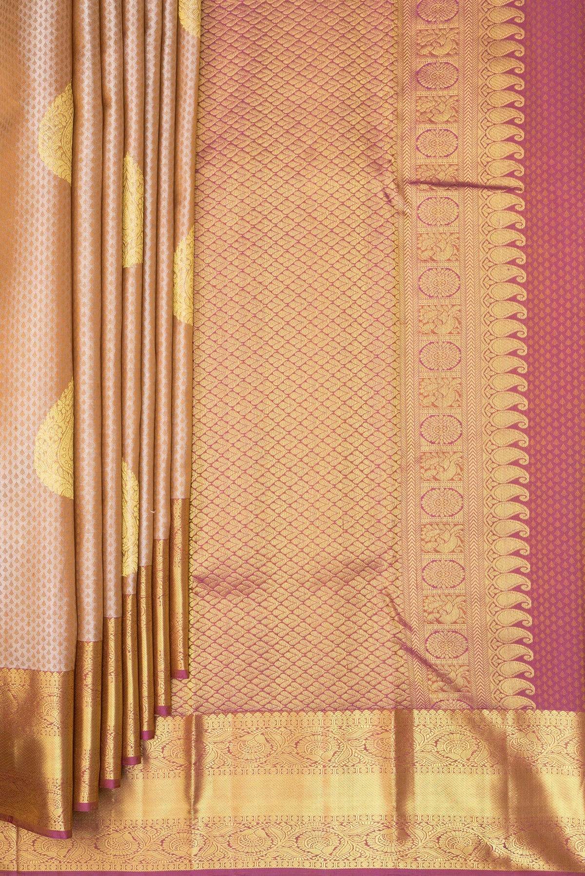 Pleats and pallu of Pure Silk Beige Dual Tone Kanchipuram Saree with Jacquard With Zari Butta on the body and Zari Border. 