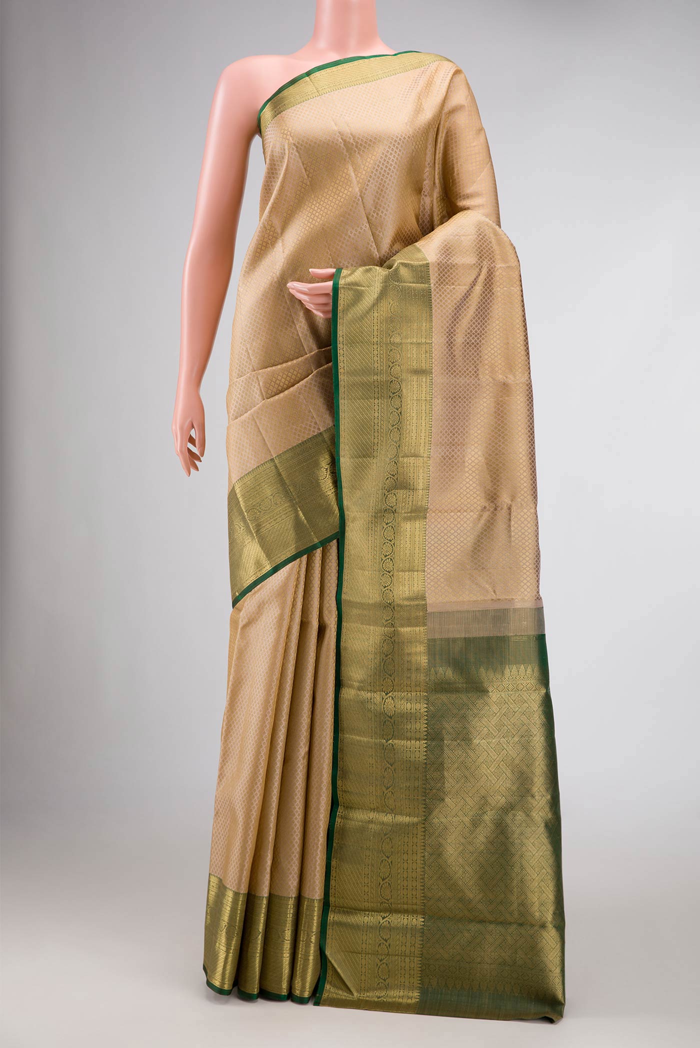Pure Silk Pure Zari Beige Dual Tone Kanchipuram Saree with Jacquard design on the body and Zari Border.  displayed on a mannequin