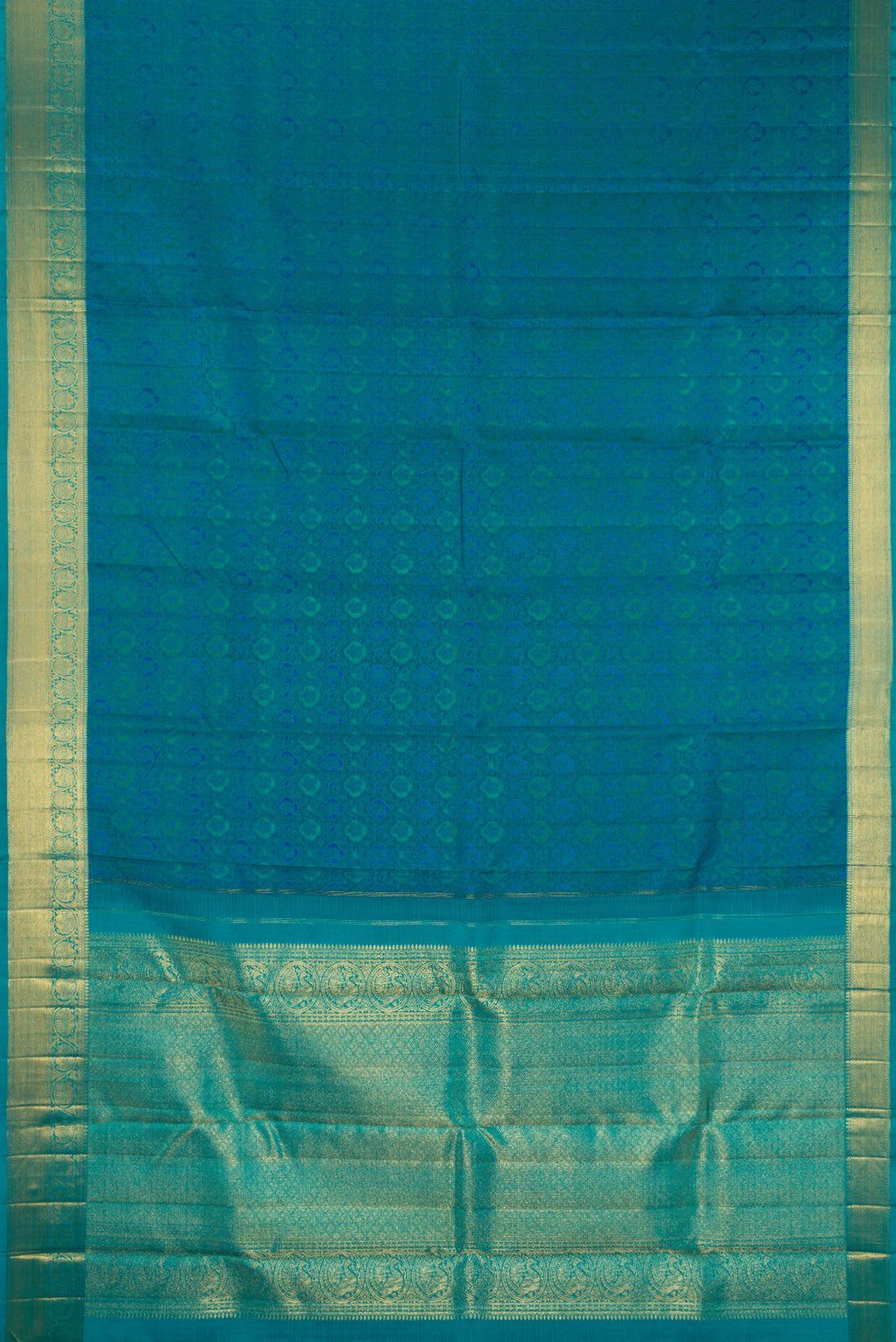 Flat view of Pure Silk Pure Zari Peacock Blue Kanchipuram Saree with Jacquard design on the body and Zari Border. 