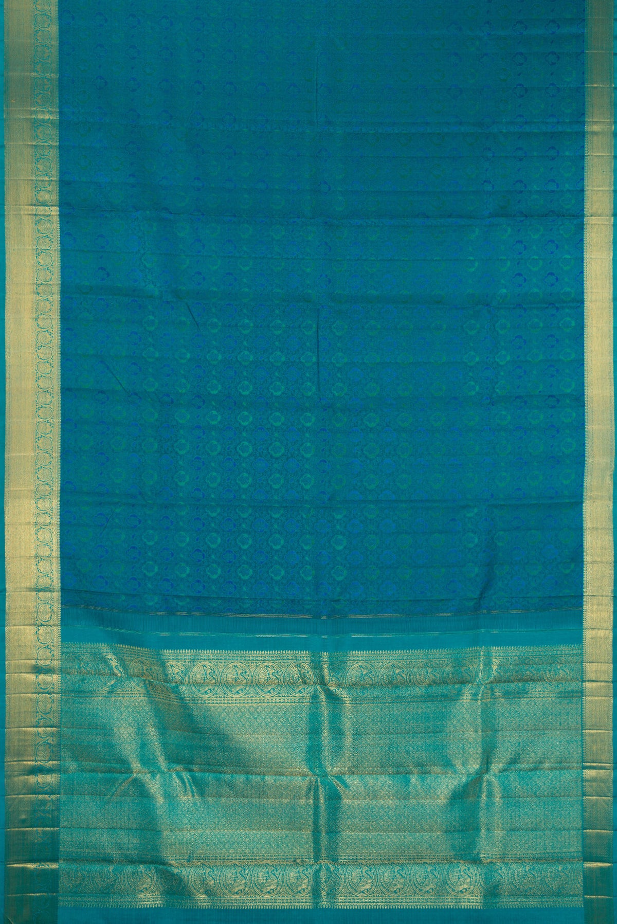 Flat view of Pure Silk Pure Zari Peacock Blue Kanchipuram Saree with Jacquard design on the body and Zari Border. 