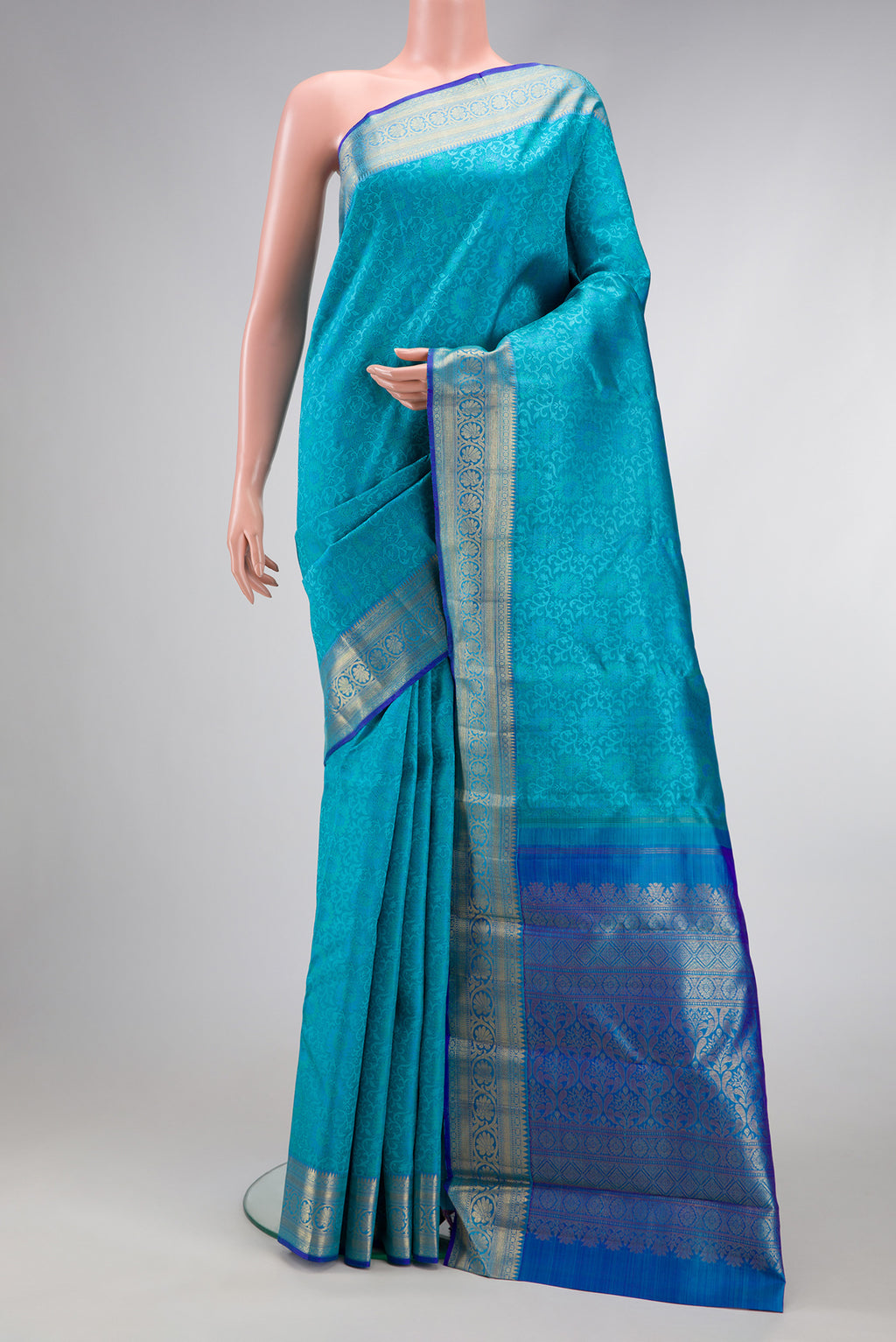 Sky Blue Dual Tone Kanchipuram Silk Saree with Jacquard design on the body and Zari Border.  displayed on a mannequin
