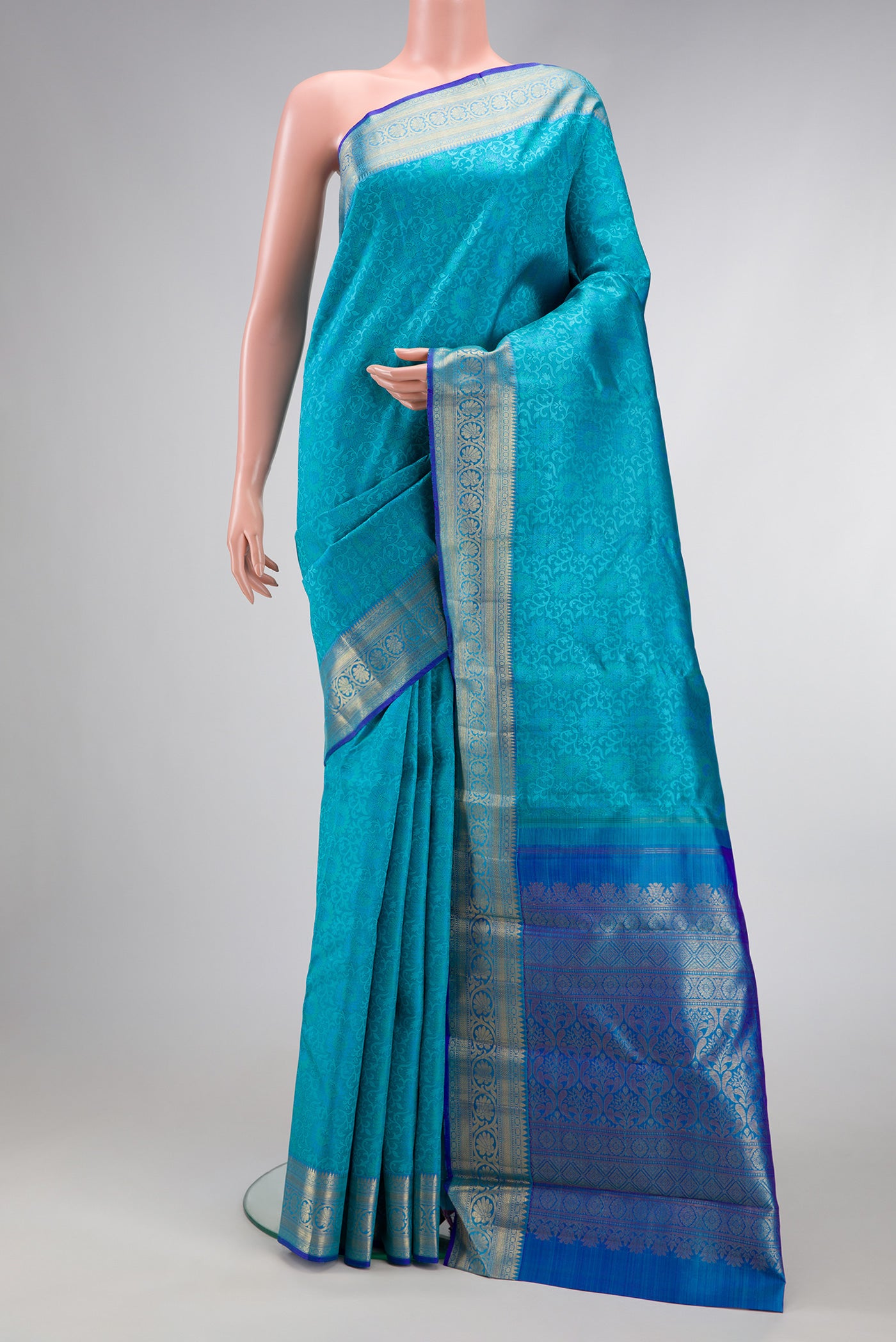 Sky Blue Dual Tone Kanchipuram Silk Saree with Jacquard design on the body and Zari Border.  displayed on a mannequin