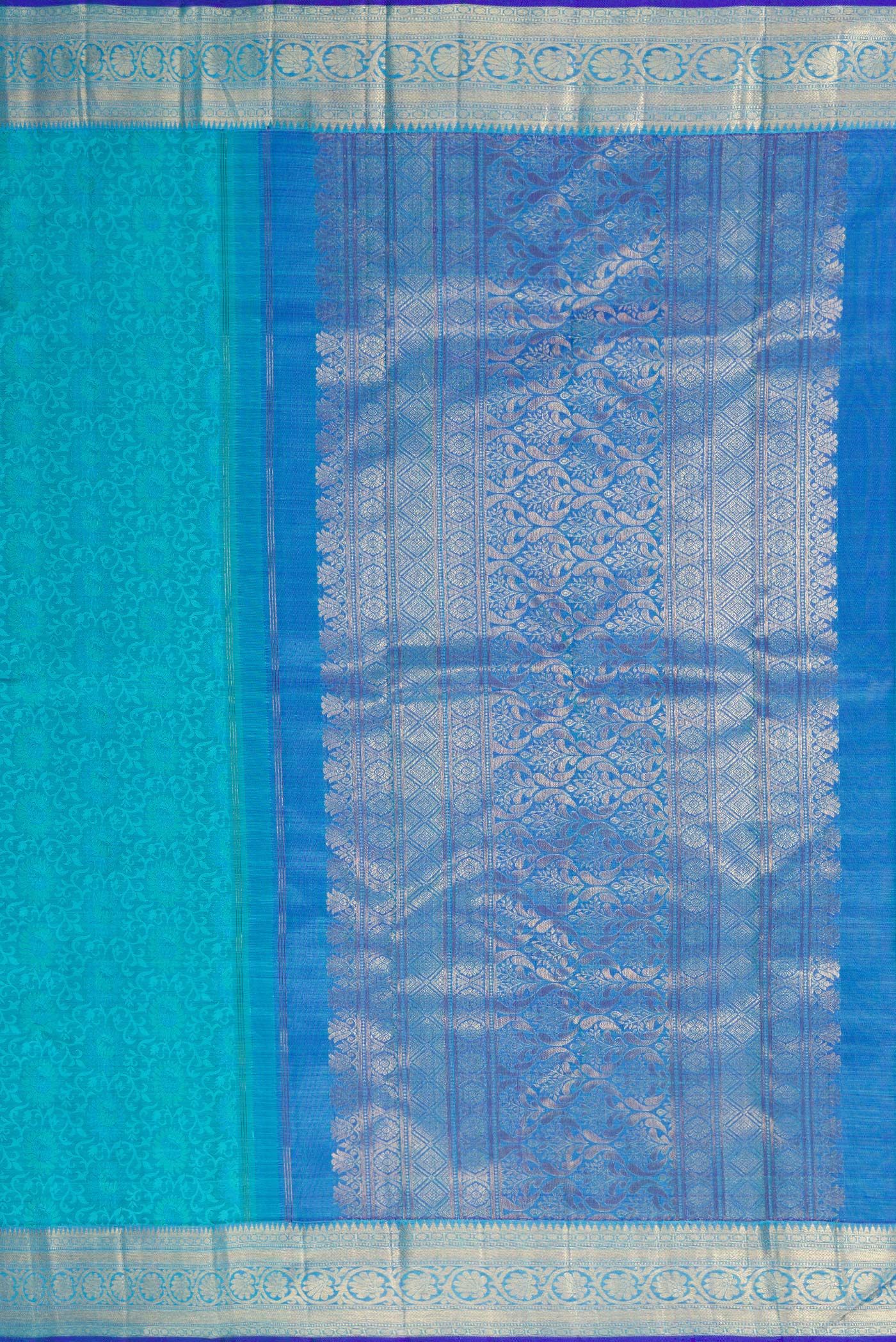 Close up image of the pallu of Sky Blue Dual Tone Kanchipuram Silk Saree with Jacquard design on the body and Zari Border. 