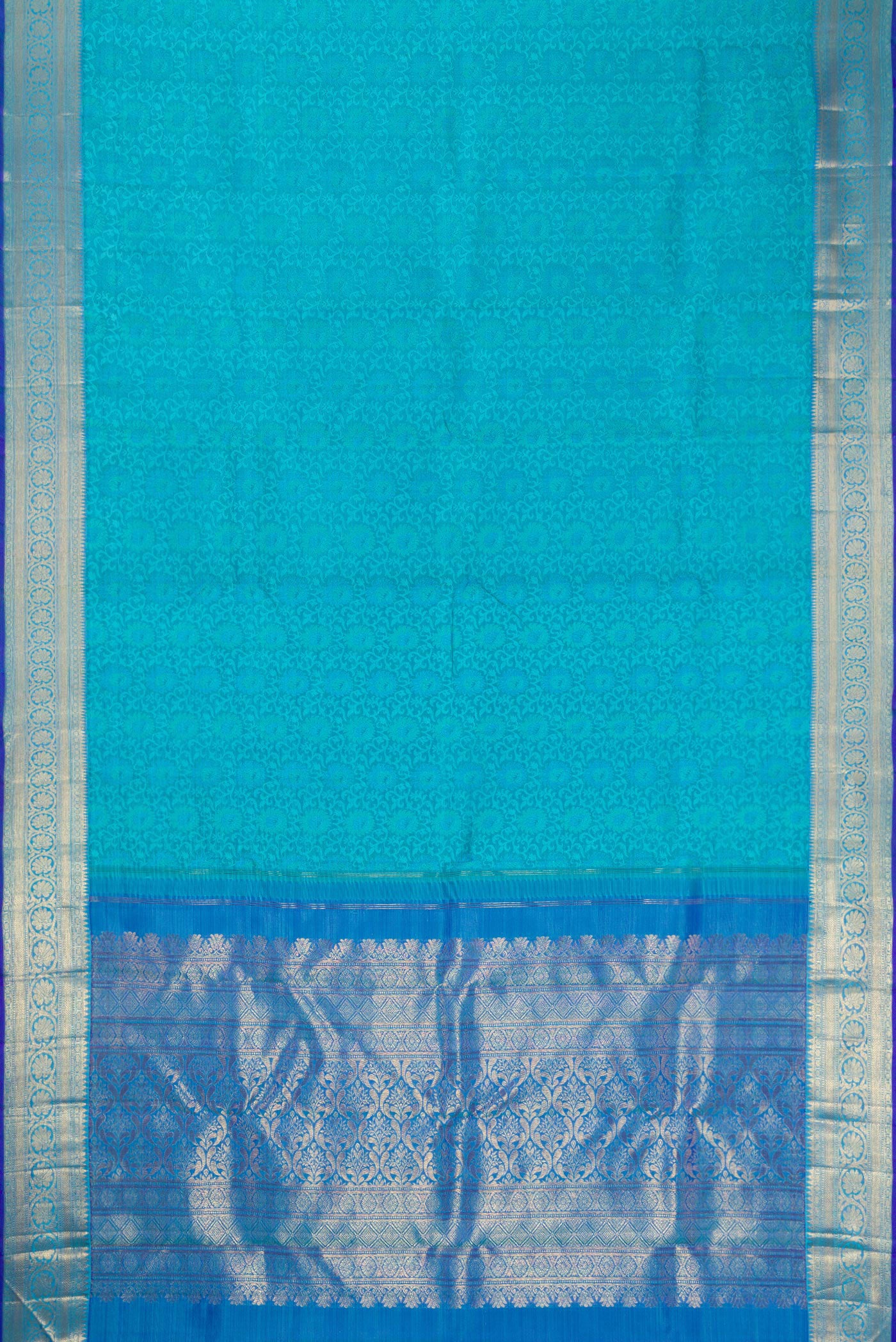 Flat view of Sky Blue Dual Tone Kanchipuram Silk Saree with Jacquard design on the body and Zari Border. 