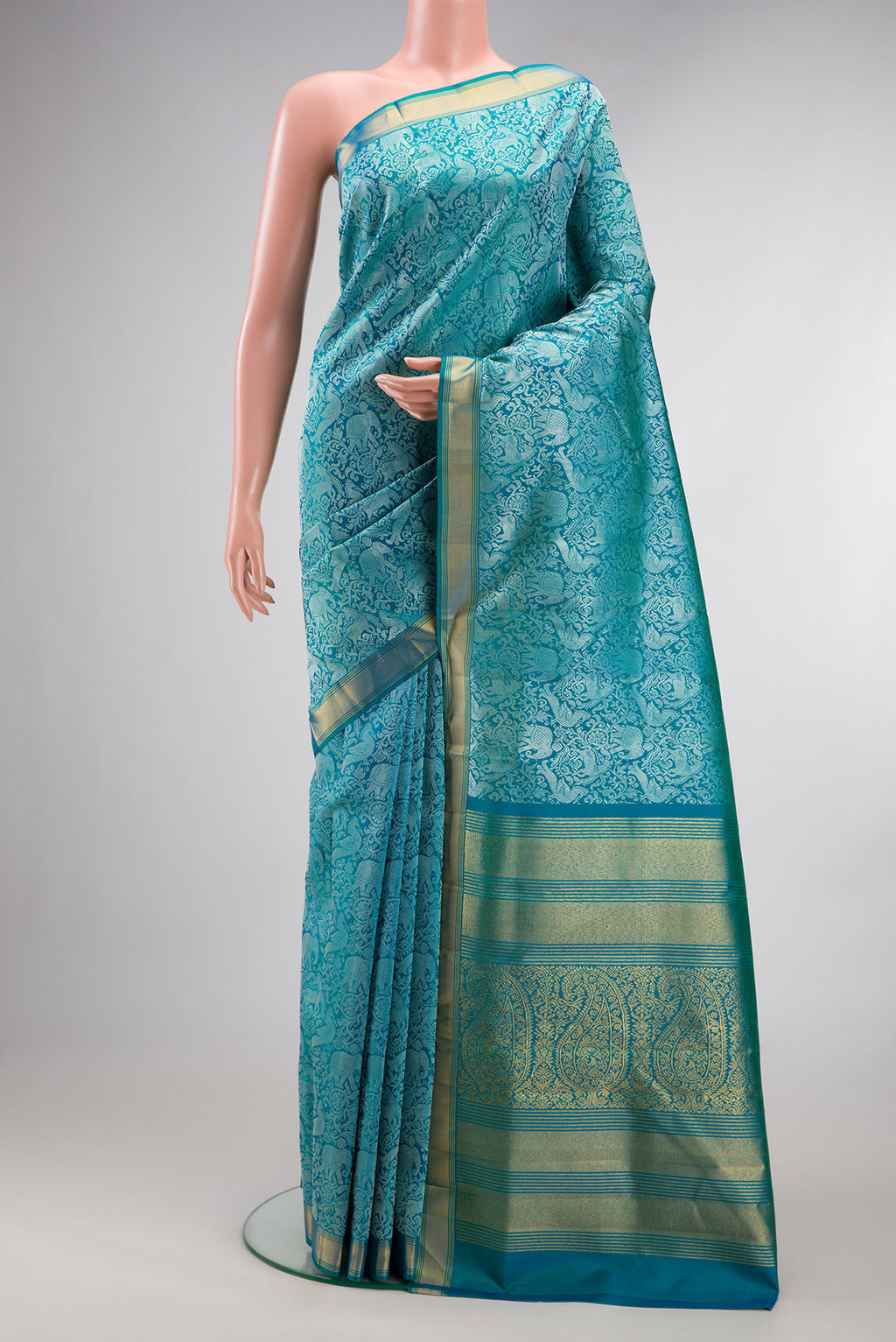 Pure Silk Pure Zari Peacock Blue Dual Tone Kanchipuram Saree with Jacquard design on the body and Zari Border.  displayed on a mannequin