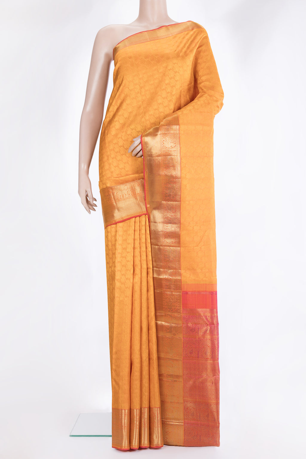 Pure Silk Pure Zari Mustard Kanchipuram Saree with Jacquard design on the body and Zari Border.  displayed on a mannequin