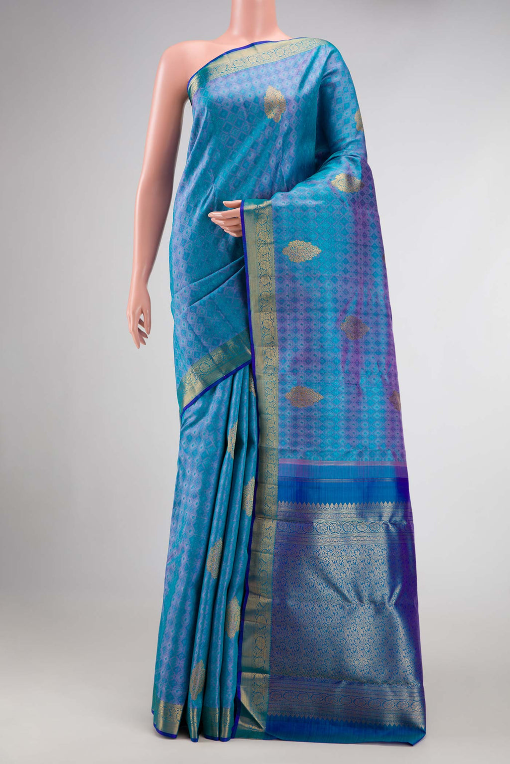 Pure Silk Pure Zari Peacock Blue Dual Tone Kanchipuram Saree with Jacquard With Zari Butta on the body and Zari Border.  displayed on a mannequin