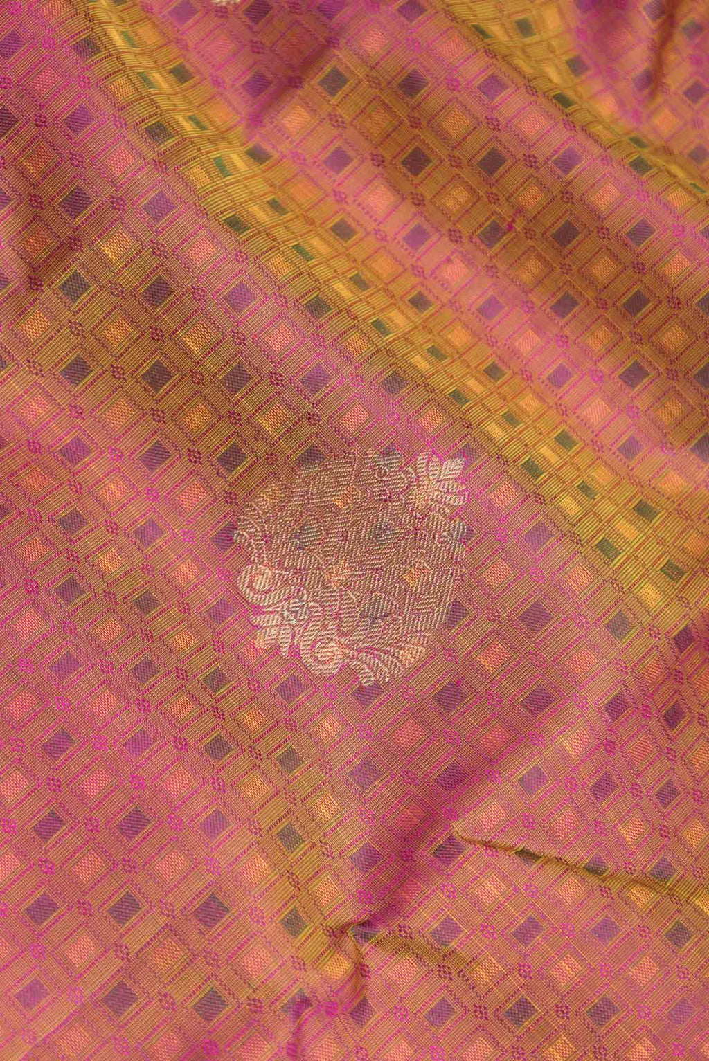 Close up of Pure Silk Pure Zari Mustard Dual Tone Kanchipuram Saree with Jacquard With Zari Butta on the body and Zari Border displaying folds