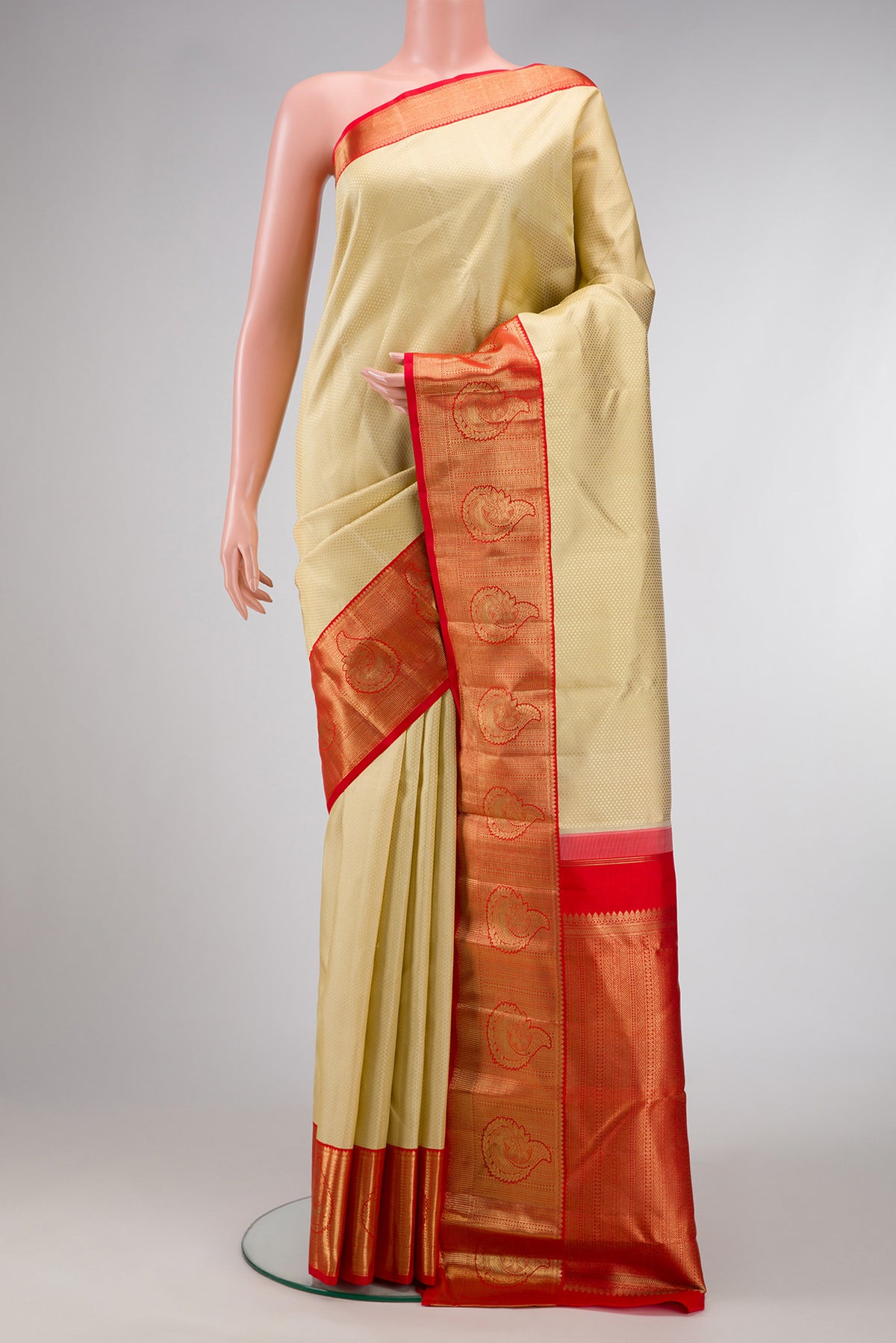 Sandal Dual Tone Kanchipuram Silk Saree with Jacquard design on the body and Zari Border.  displayed on a mannequin