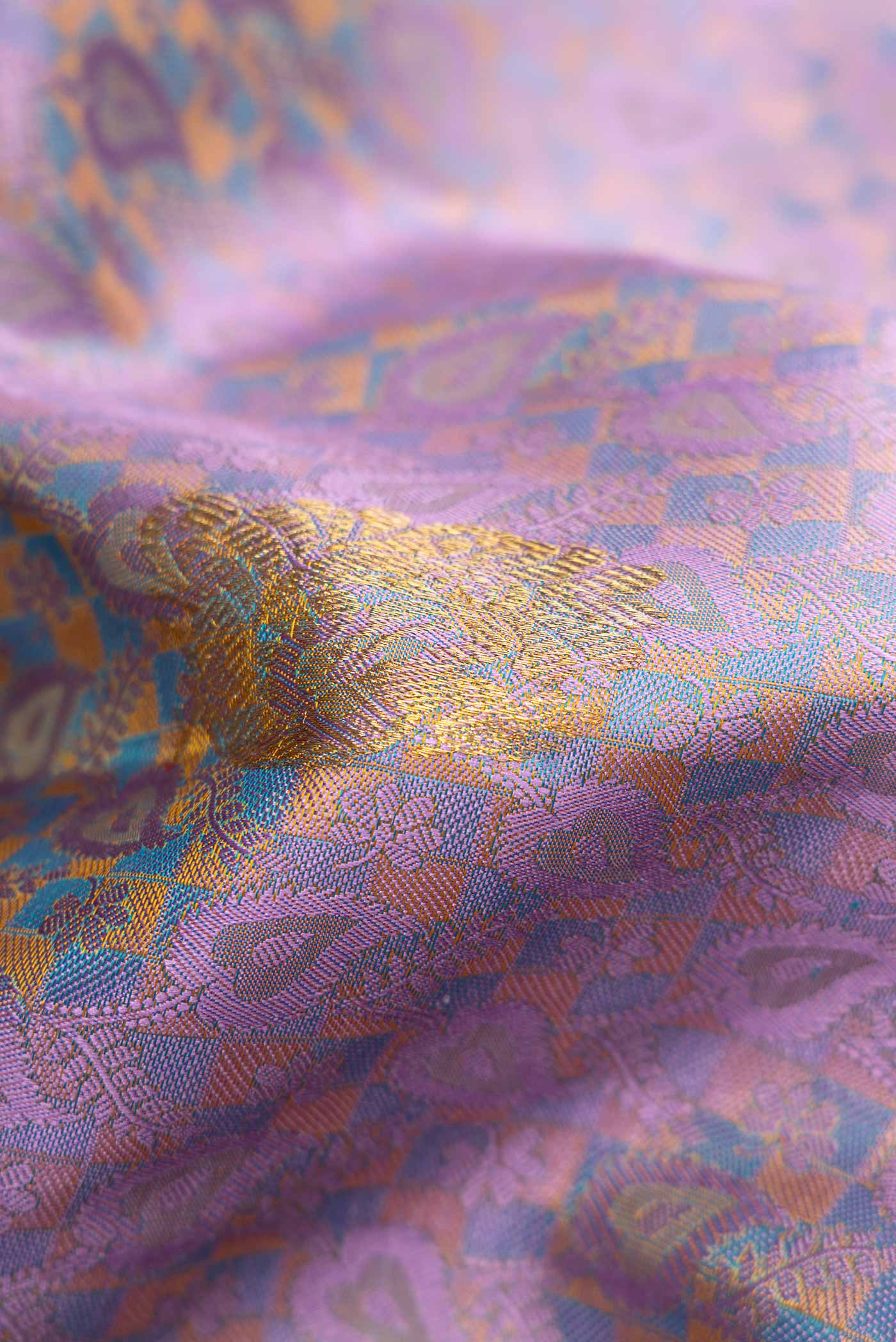Close up of Pure Silk Pure Zari Lavender Dual Tone Kanchipuram Saree with Jacquard With Zari Butta on the body and Zari Border.  displaying folds