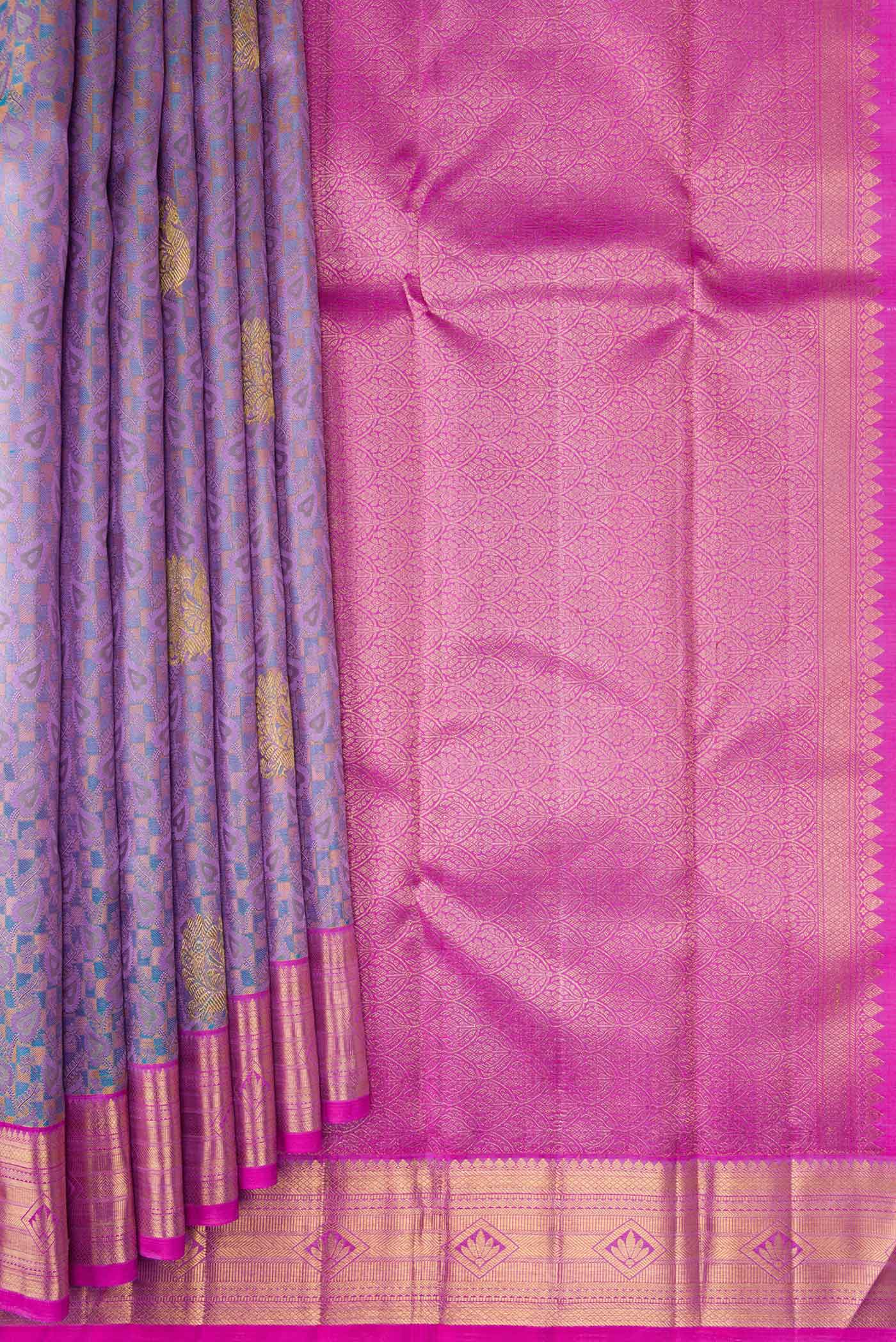 Pleats and pallu of Pure Silk Pure Zari Lavender Dual Tone Kanchipuram Saree with Jacquard With Zari Butta on the body and Zari Border. 