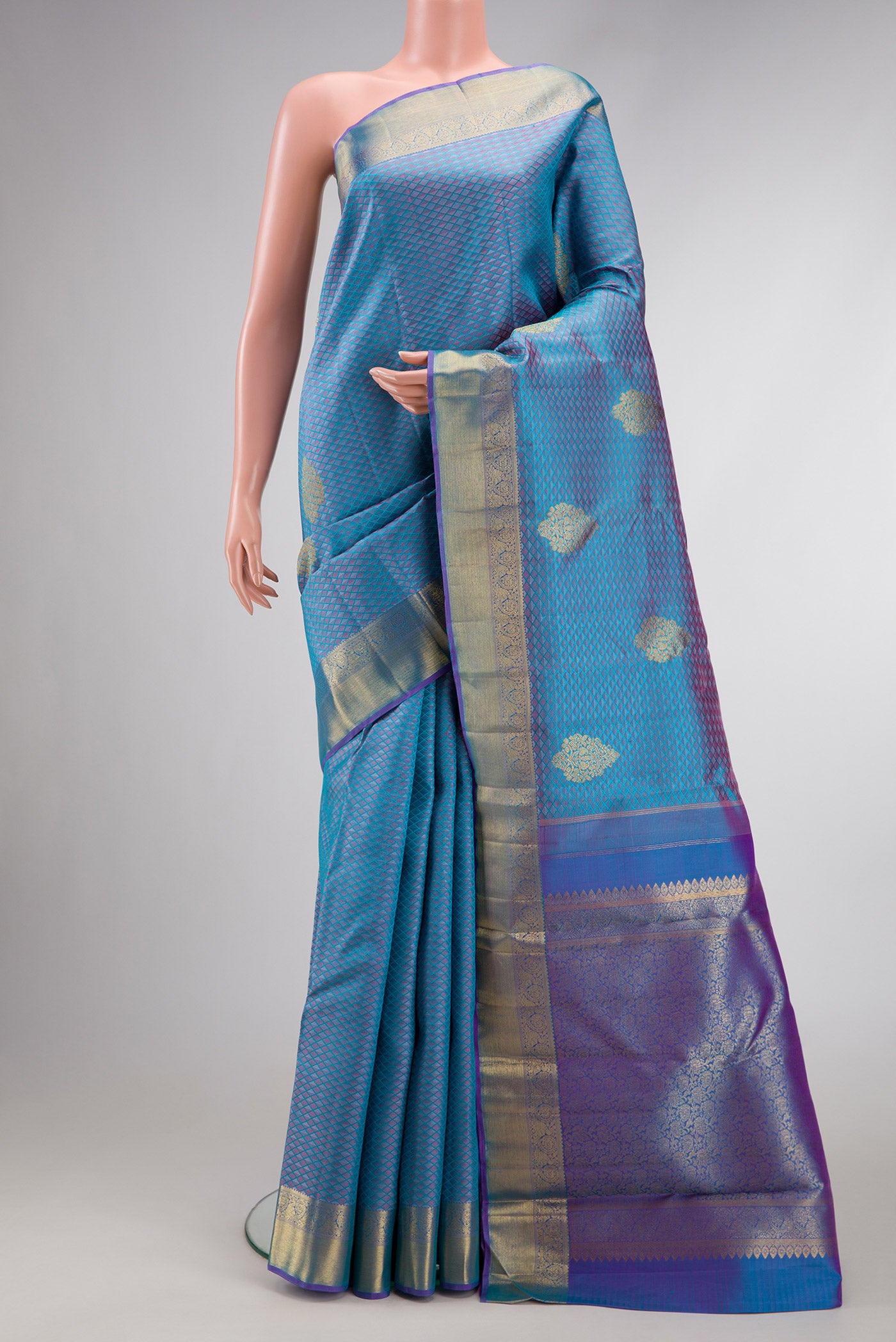 Pure Silk Pure Zari Light Blue Dual Tone Kanchipuram Saree with Jacquard With Zari Butta on the body and Zari Border.  displayed on a mannequin