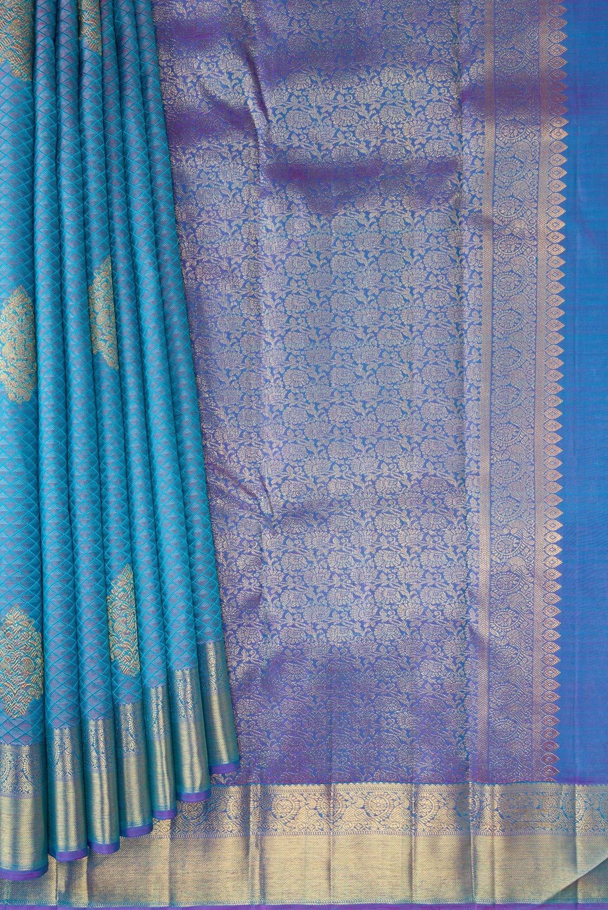 Pleats and pallu of Pure Silk Pure Zari Light Blue Dual Tone Kanchipuram Saree with Jacquard With Zari Butta on the body and Zari Border. 