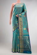 Pure Silk Pure Zari Peacock Blue Dual Tone Kanchipuram Saree with Jacquard With Zari Butta on the body and Zari Border.  displayed on a mannequin