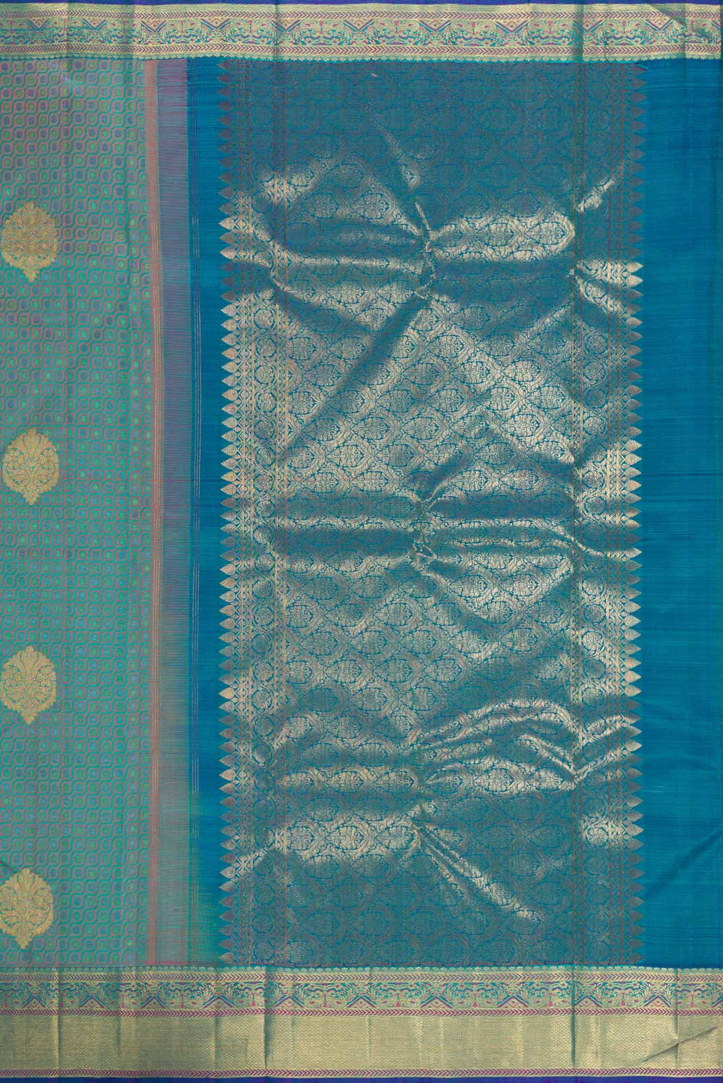 Close up image of the pallu of Pure Silk Pure Zari Peacock Blue Dual Tone Kanchipuram Saree with Jacquard With Zari Butta on the body and Zari Border. 