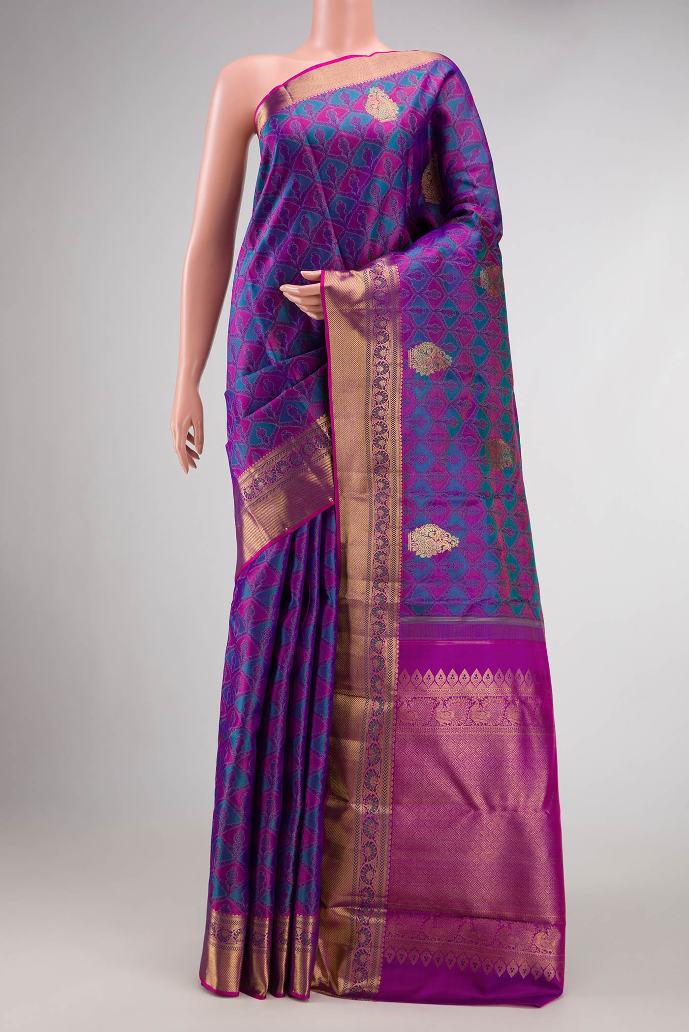 Pure Silk Pure Zari Purple Dual Tone Kanchipuram Saree with Jacquard With Zari Butta on the body and Zari Border.  displayed on a mannequin