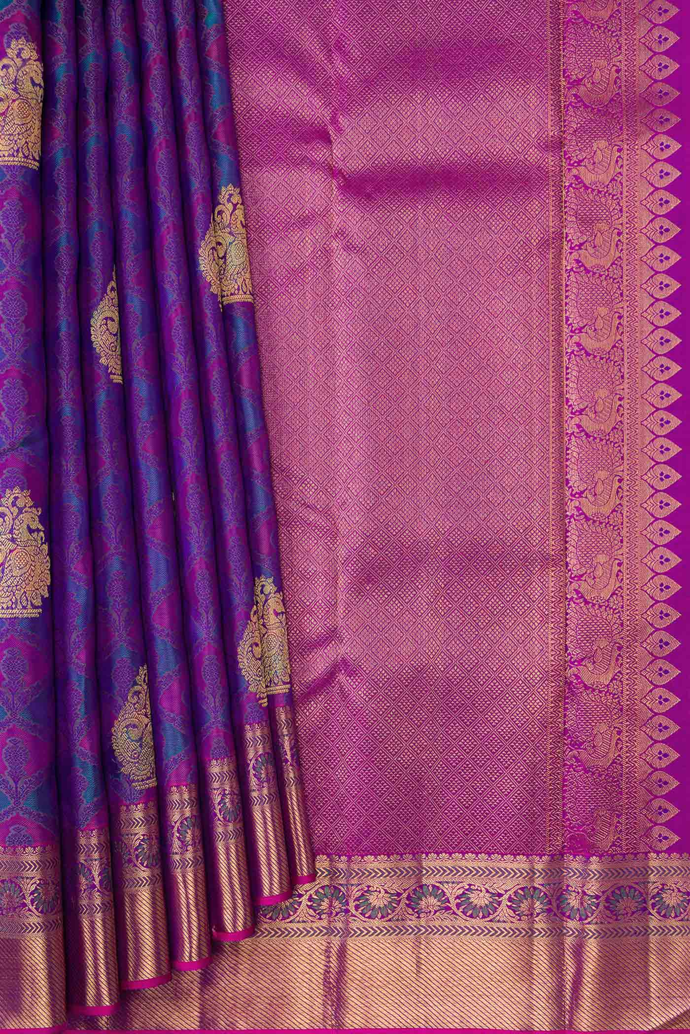 Pleats and pallu of Pure Silk Pure Zari Purple Dual Tone Kanchipuram Saree with Jacquard With Zari Butta on the body and Zari Border. 