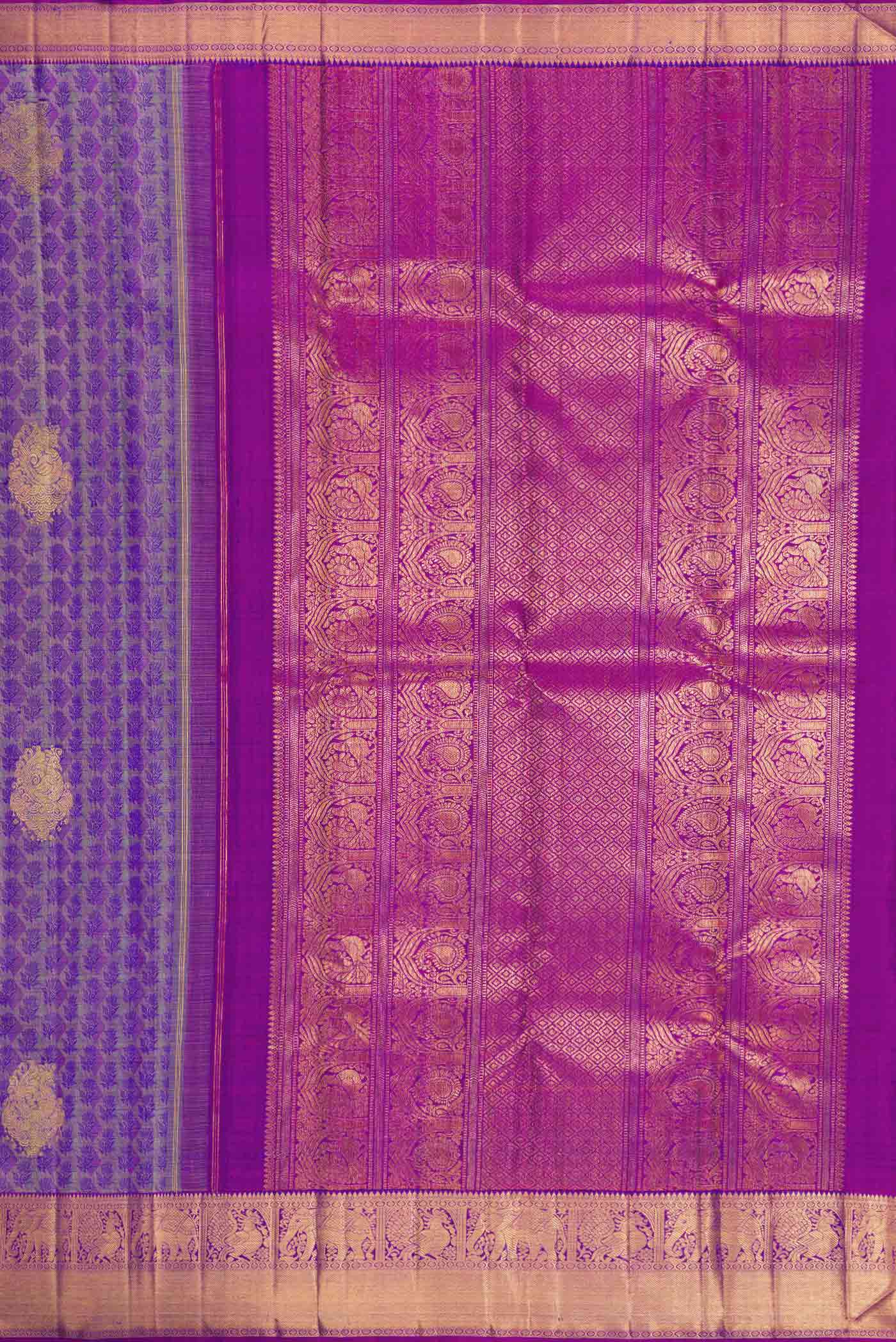 Close up image of the pallu of Pure Silk Pure Zari Purple Dual Tone Kanchipuram Saree with Jacquard With Zari Butta on the body and Zari Border. 