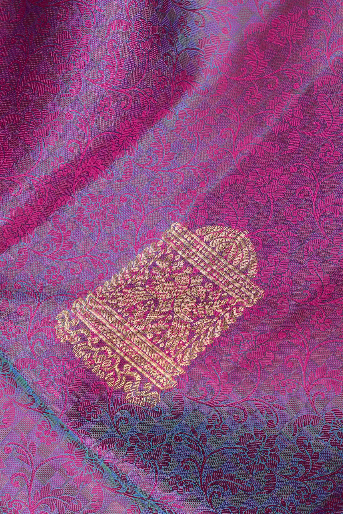 Close up of Pure Silk Purple Dual Tone Kanchipuram Saree with Jacquard With Zari Butta on the body and Zari Border.  displaying folds
