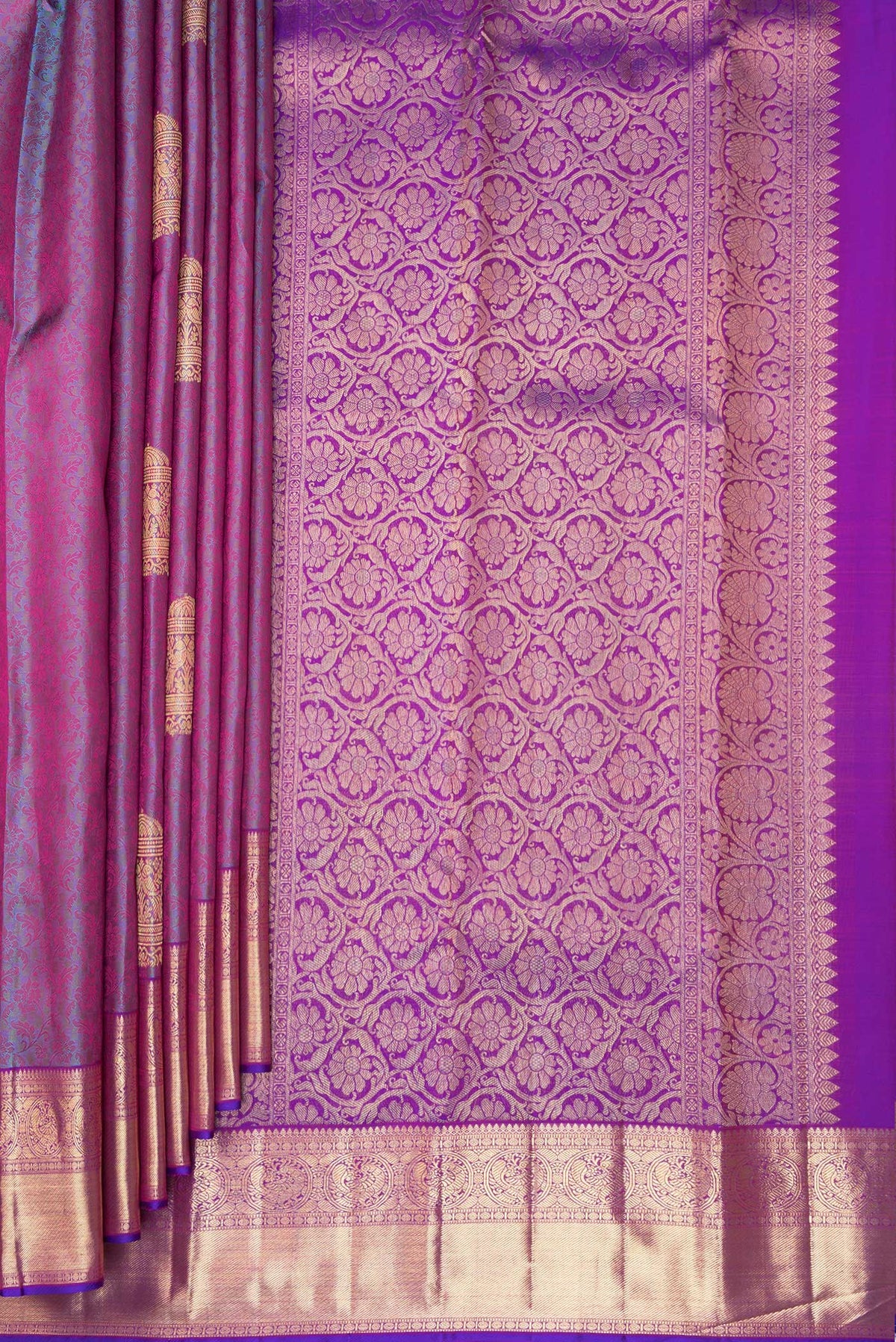 Pleats and pallu of Pure Silk Purple Dual Tone Kanchipuram Saree with Jacquard With Zari Butta on the body and Zari Border. 