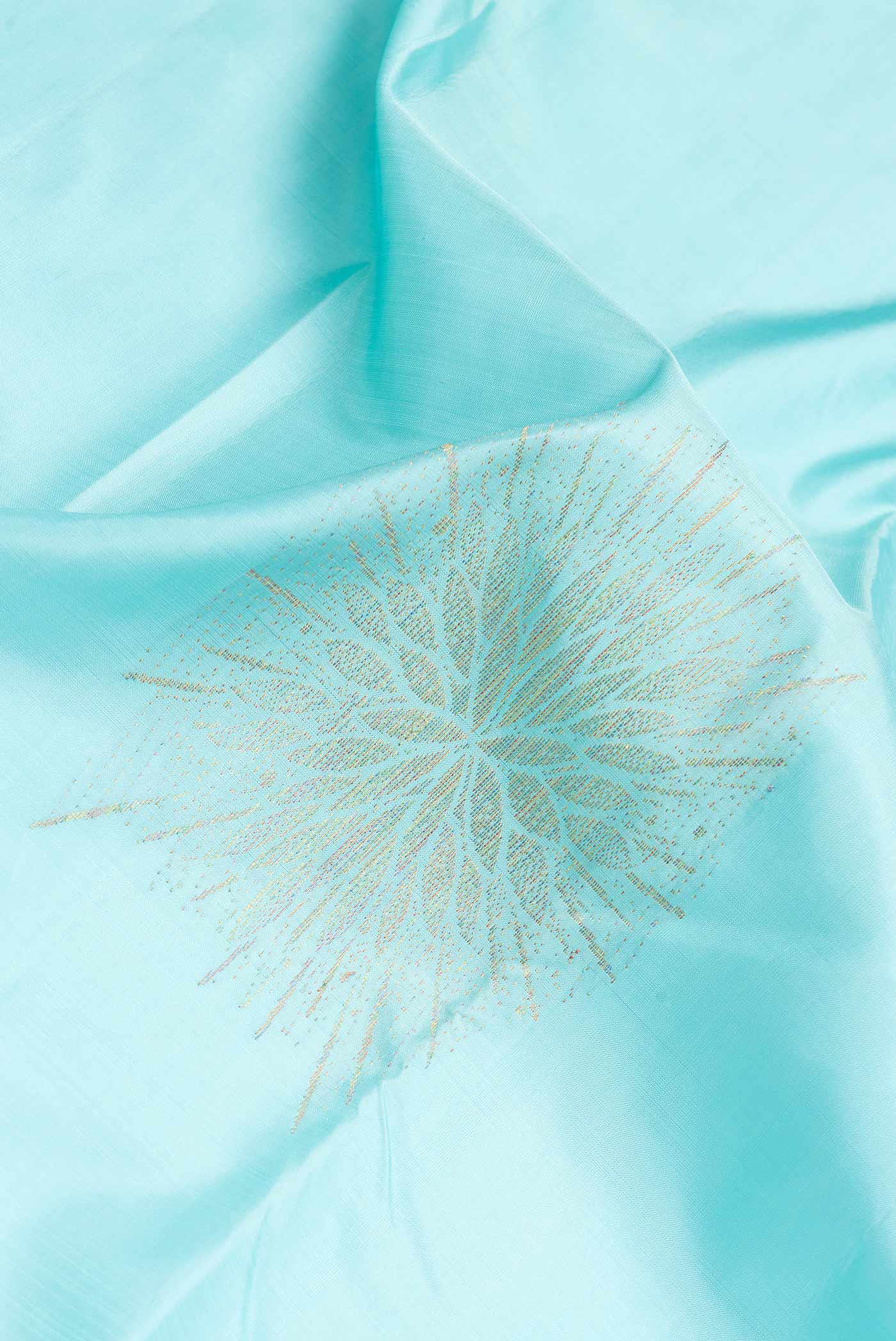 Close up of Sky Blue Dual Tone Kanchipuram Silk Saree with Zari Butta on the body and Without Border.  displaying folds