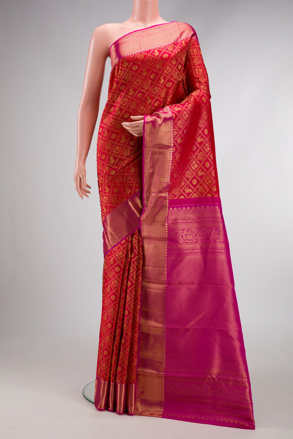 Dark Pink Dual Tone Kanchipuram Silk Saree with Zari Brocade on the body and Zari Border.  displayed on a mannequin