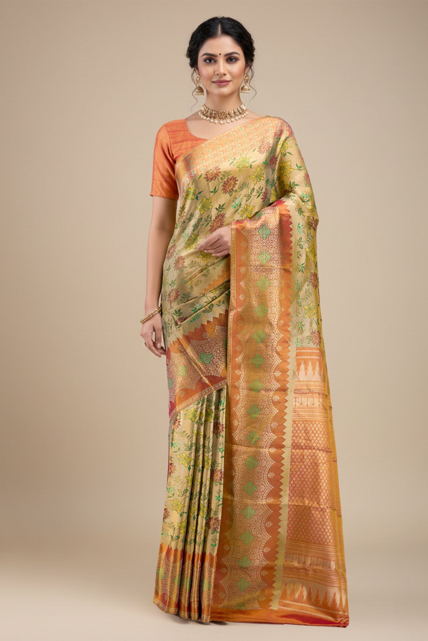 Model wearing a Green Dual Tone Kanchipuram Tissue Silk Saree with Zari Brocade on the body and Zari Border.