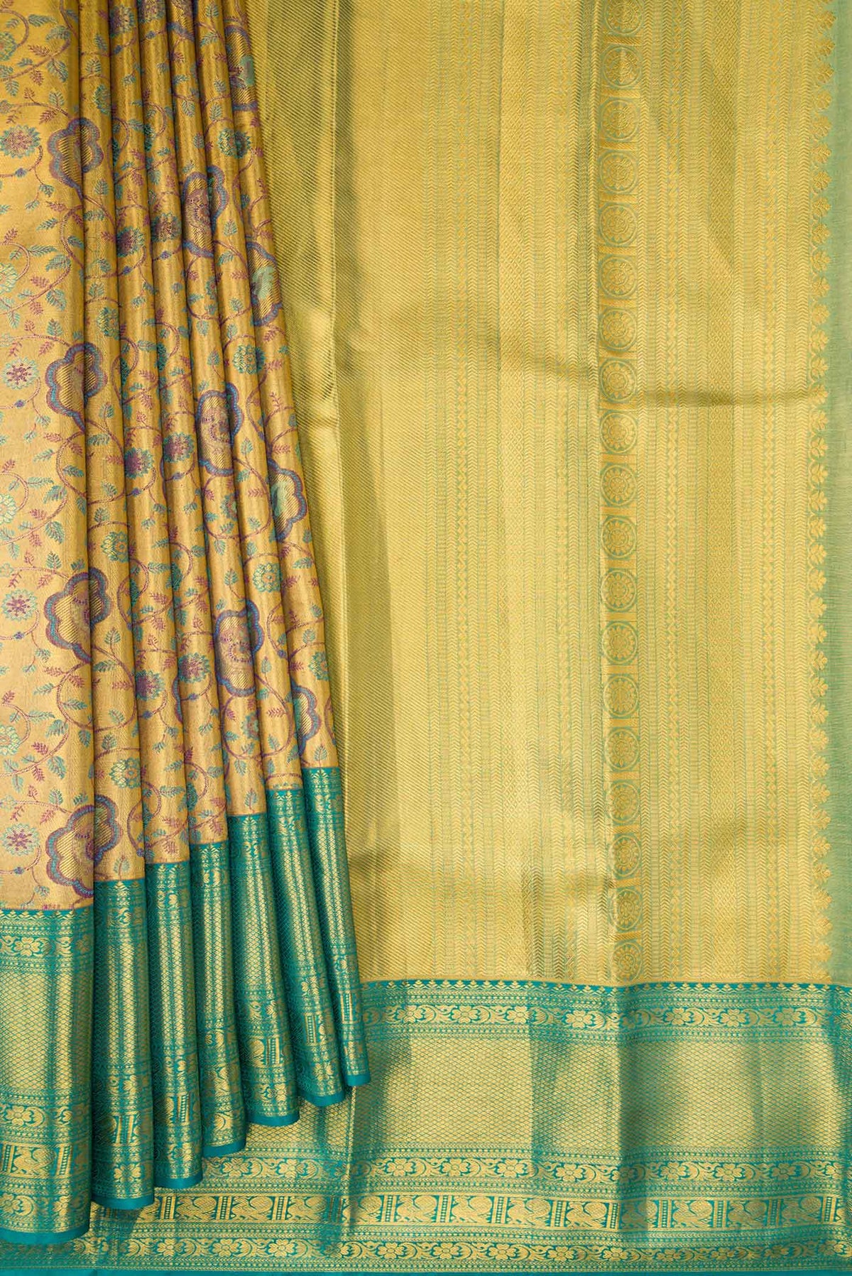 Pleats and pallu of Gold Dual Tone Kanchipuram Tissue Silk Saree with Zari Brocade on the body and Zari Border. 