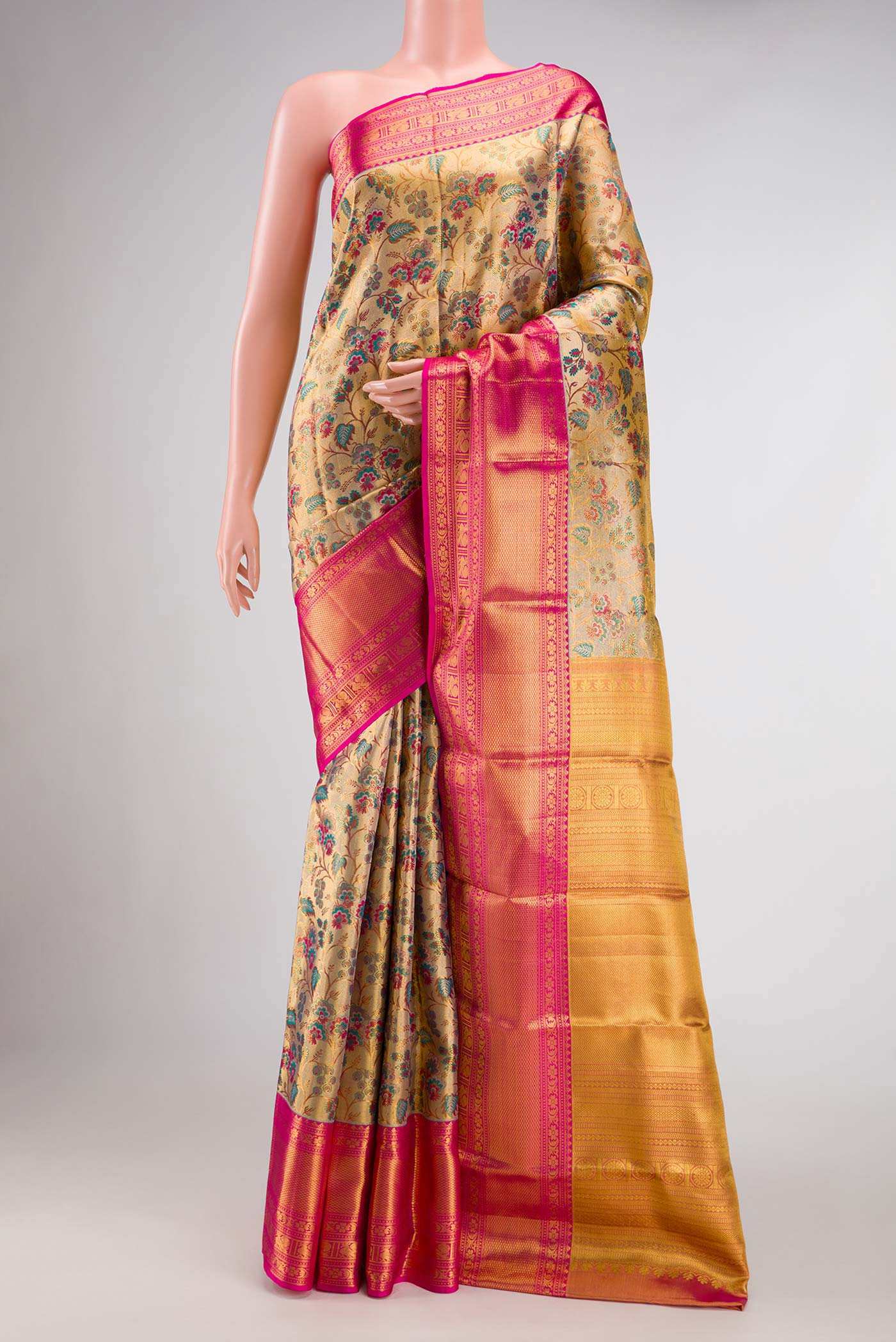 Gold Dual Tone Kanchipuram Tissue Silk Saree with Zari Brocade on the body and Zari Border.  displayed on a mannequin