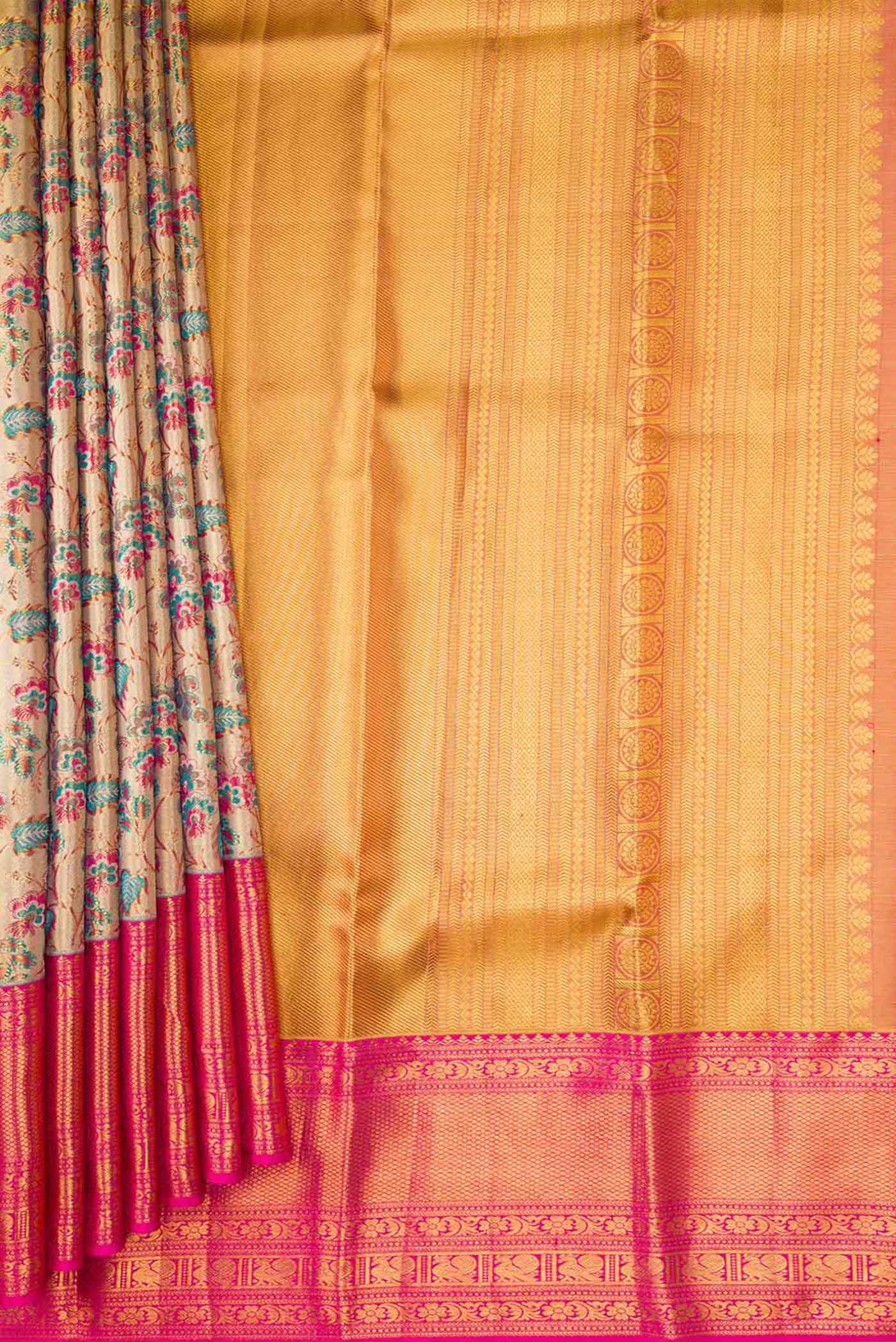 Pleats and pallu of Gold Dual Tone Kanchipuram Tissue Silk Saree with Zari Brocade on the body and Zari Border. 