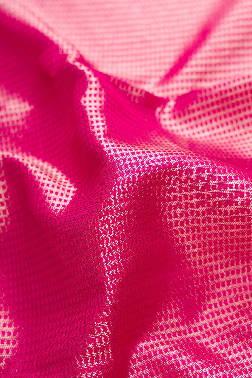 Close up of Pink Dual Tone Kanchipuram Saree with Zari Brocade on the body and Zari Border displaying folds