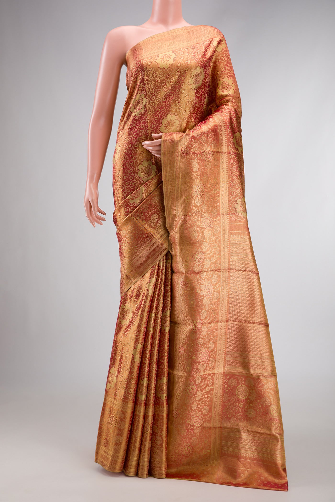 Pink Dual Tone Kanchipuram Tissue Silk Saree with Zari Brocade on the body and Zari Border.  displayed on a mannequin