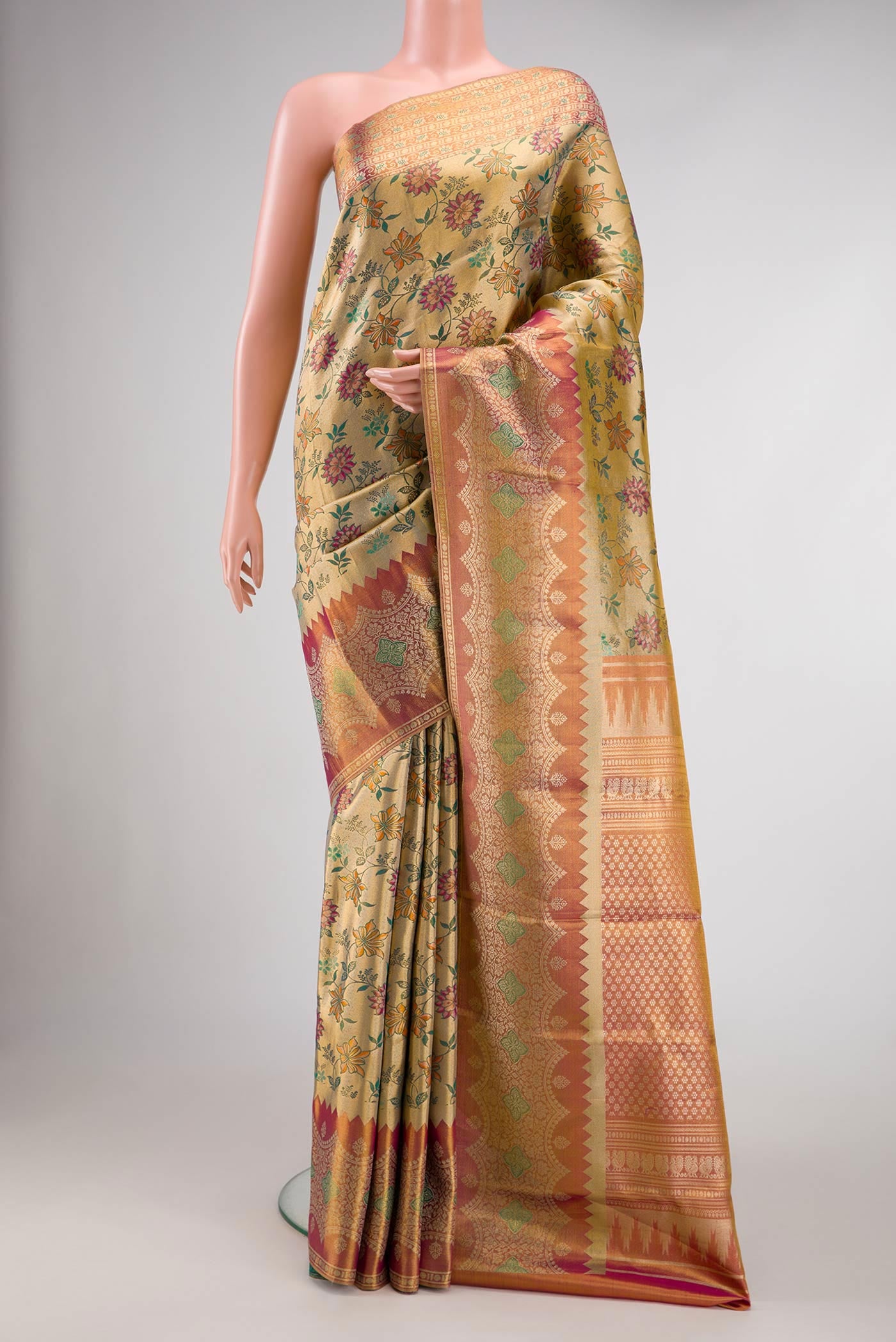 Gold Dual Tone Kanjivaram Tissue Silk Saree with Zari Brocade on the body and Zari Border.  displayed on a mannequin