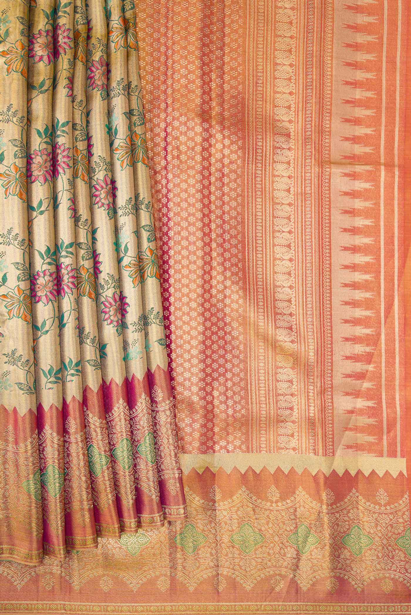 Pleats and pallu of Gold Dual Tone Kanjivaram Tissue Silk Saree with Zari Brocade on the body and Zari Border. 