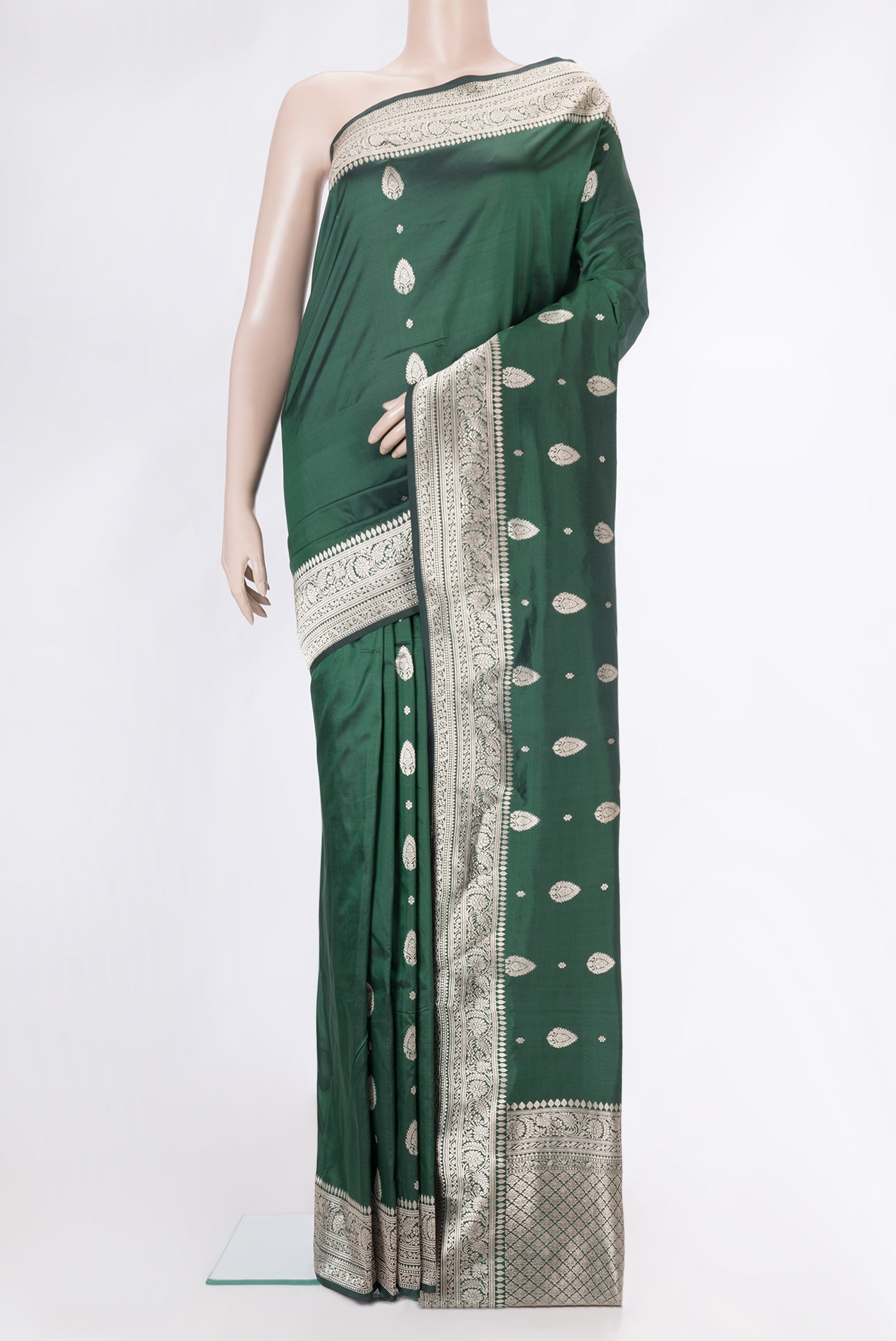 Bottle Green Dual Tone Banarasi Silk Saree with Zari Butta on the body and Zari Border.  displayed on a mannequin