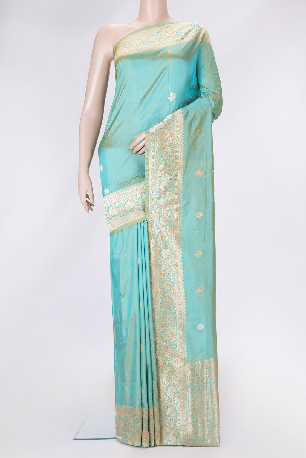 Sky Blue Dual Tone Banarasi Silk Saree with Zari Butta on the body and Zari Border.  displayed on a mannequin