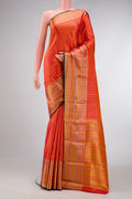 Orange Dual Tone Double Ikat Saree with Checked design on the body and Zari Border.  displayed on a mannequin