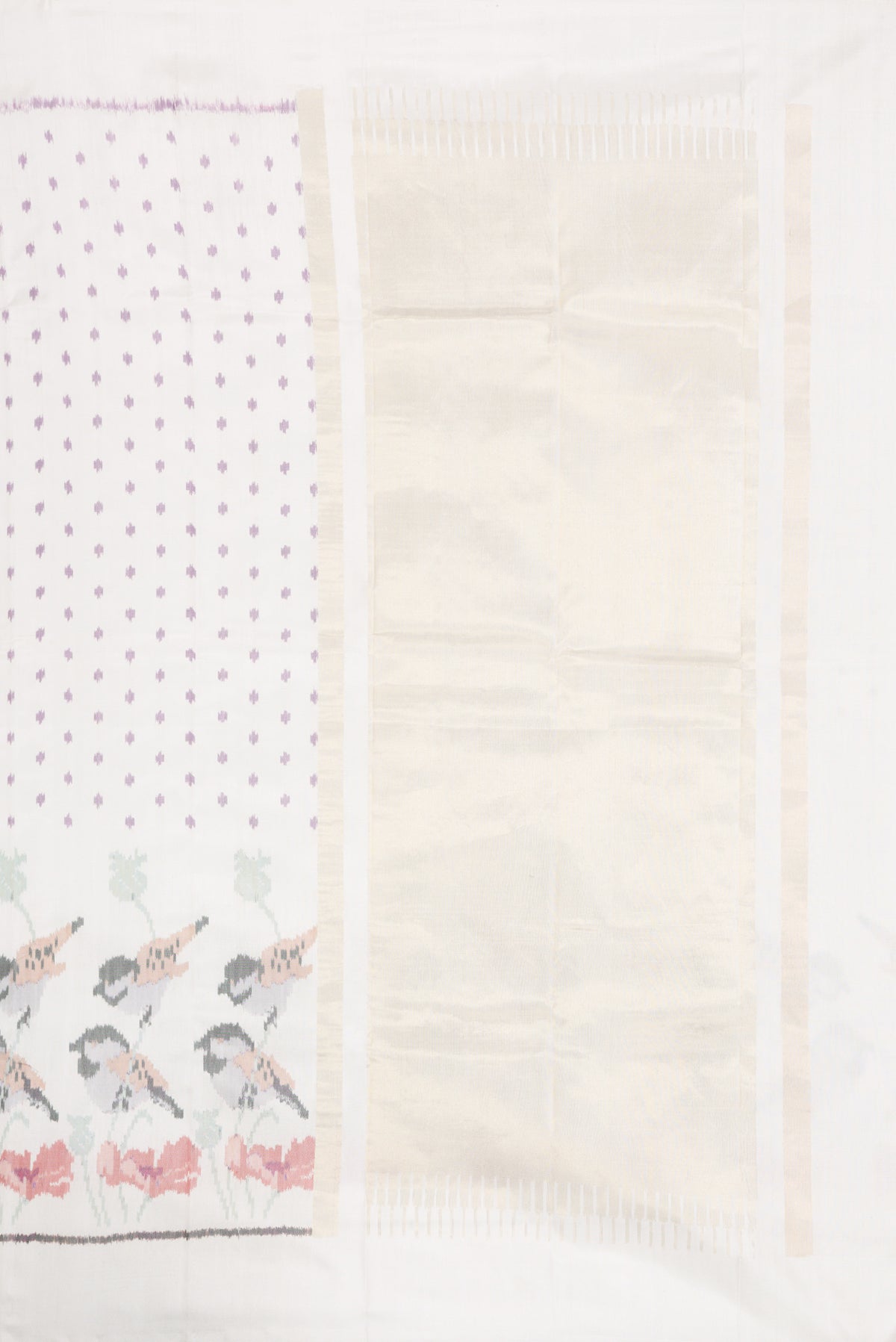 Close up image of the pallu of White Dual Tone Rajkot Patola Silk Saree with Ikat Print on the body and Ikat Border. 